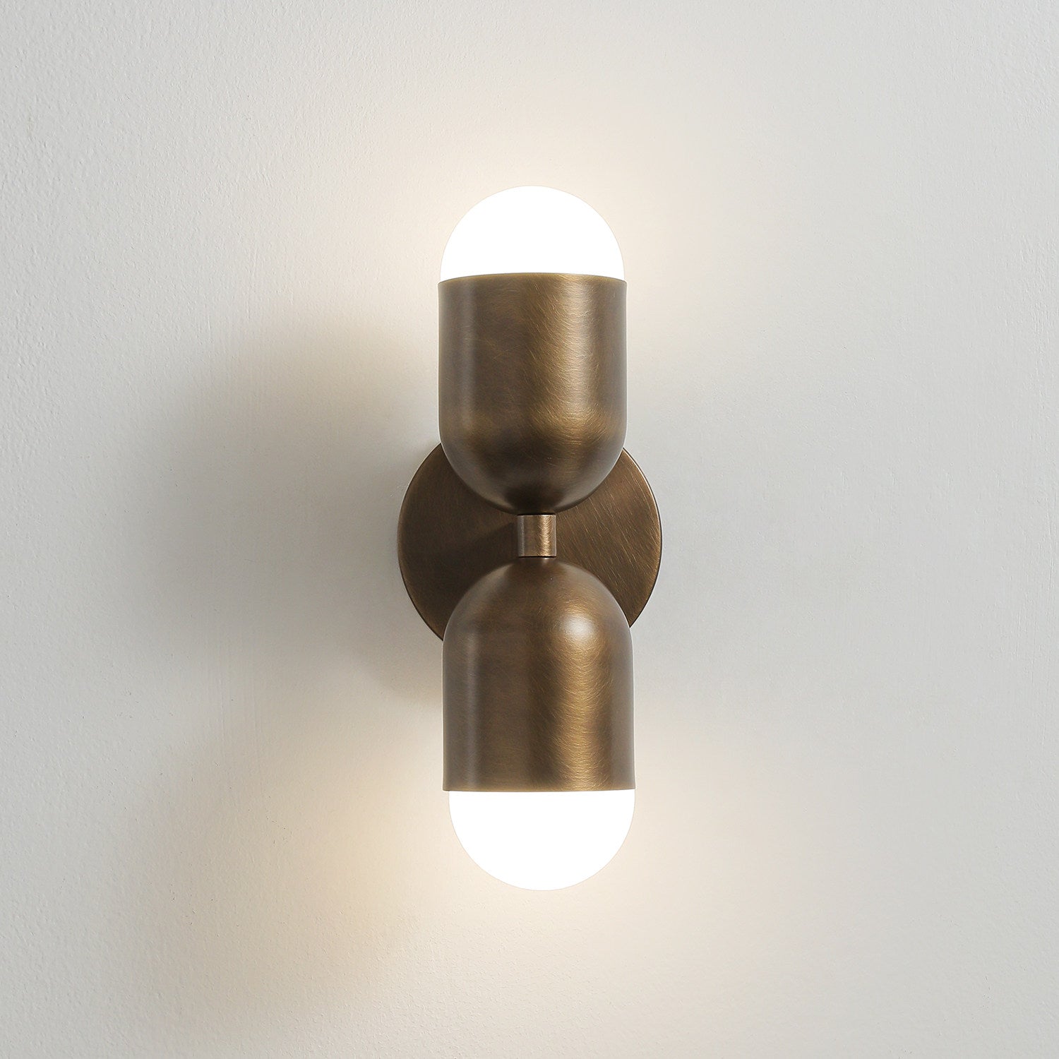 Jensen Wall Sconce casting a soft, glare-free ambient glow.