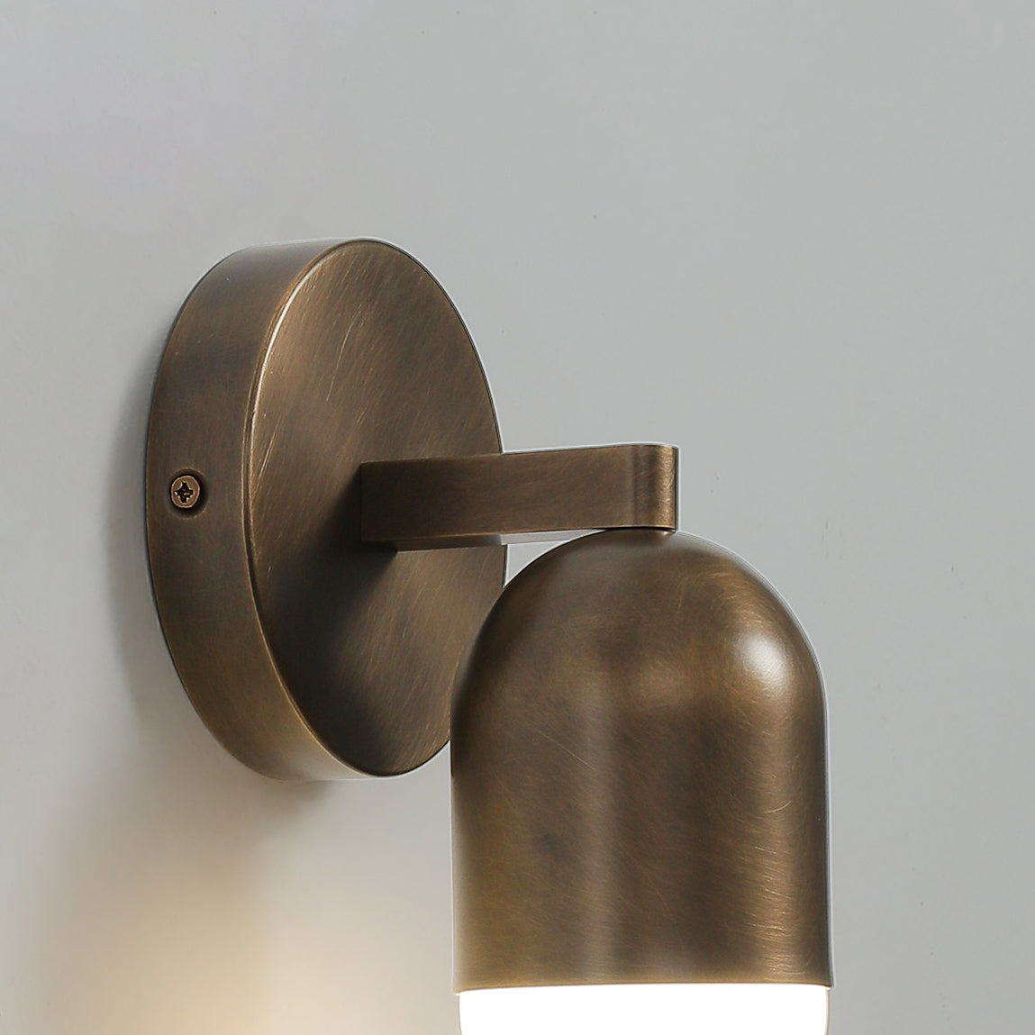 A single Jensen Wall Sconce creating a focal point on a wall.