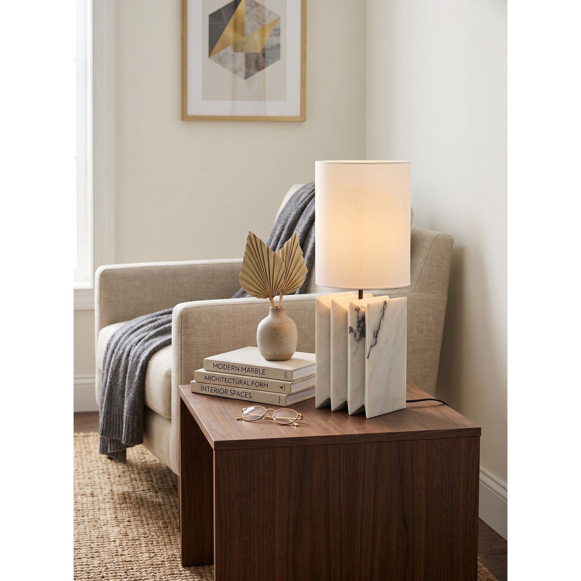 Black marble version of the Jman Table Lamp against a light, neutral background.