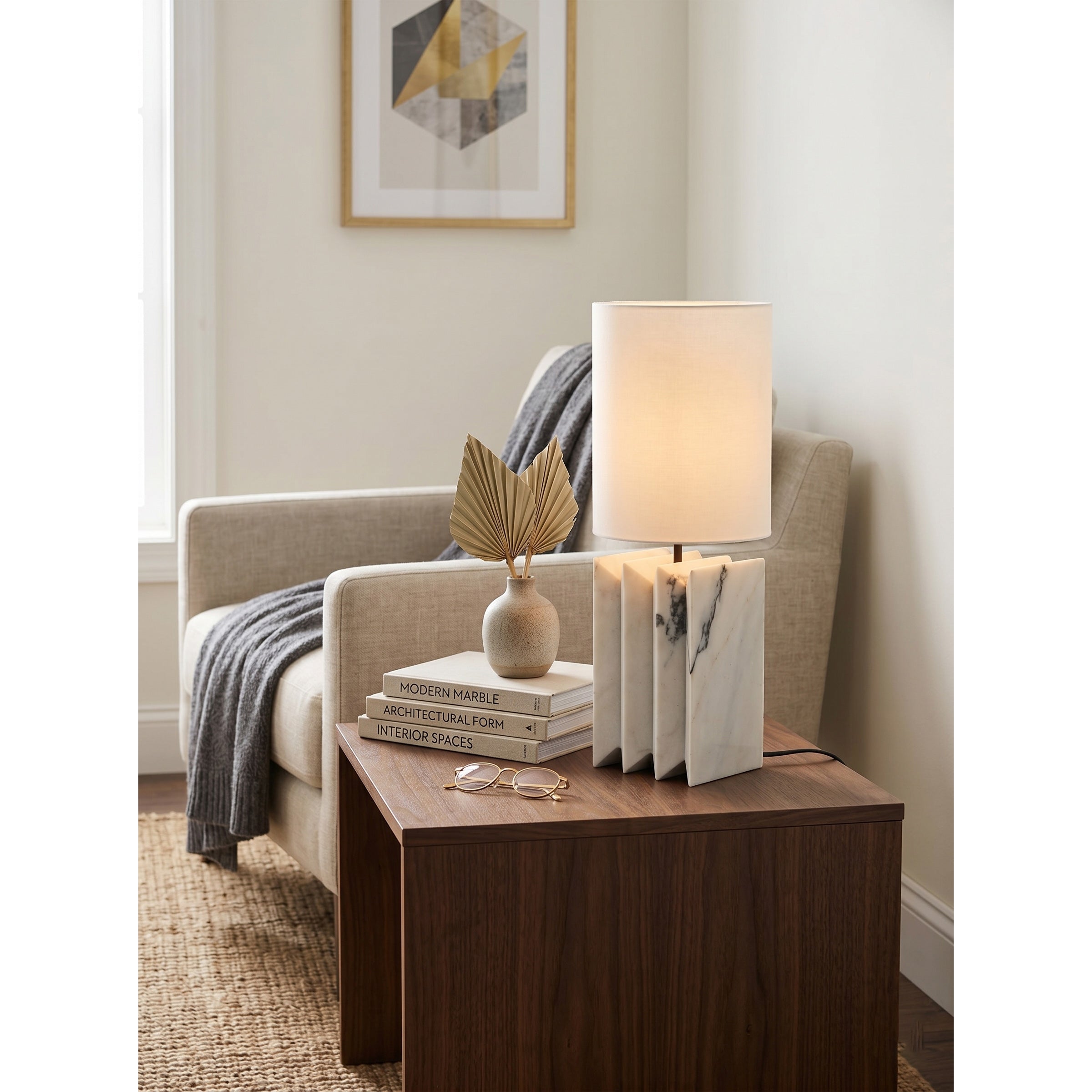 Black marble version of the Jman Table Lamp against a light, neutral background.