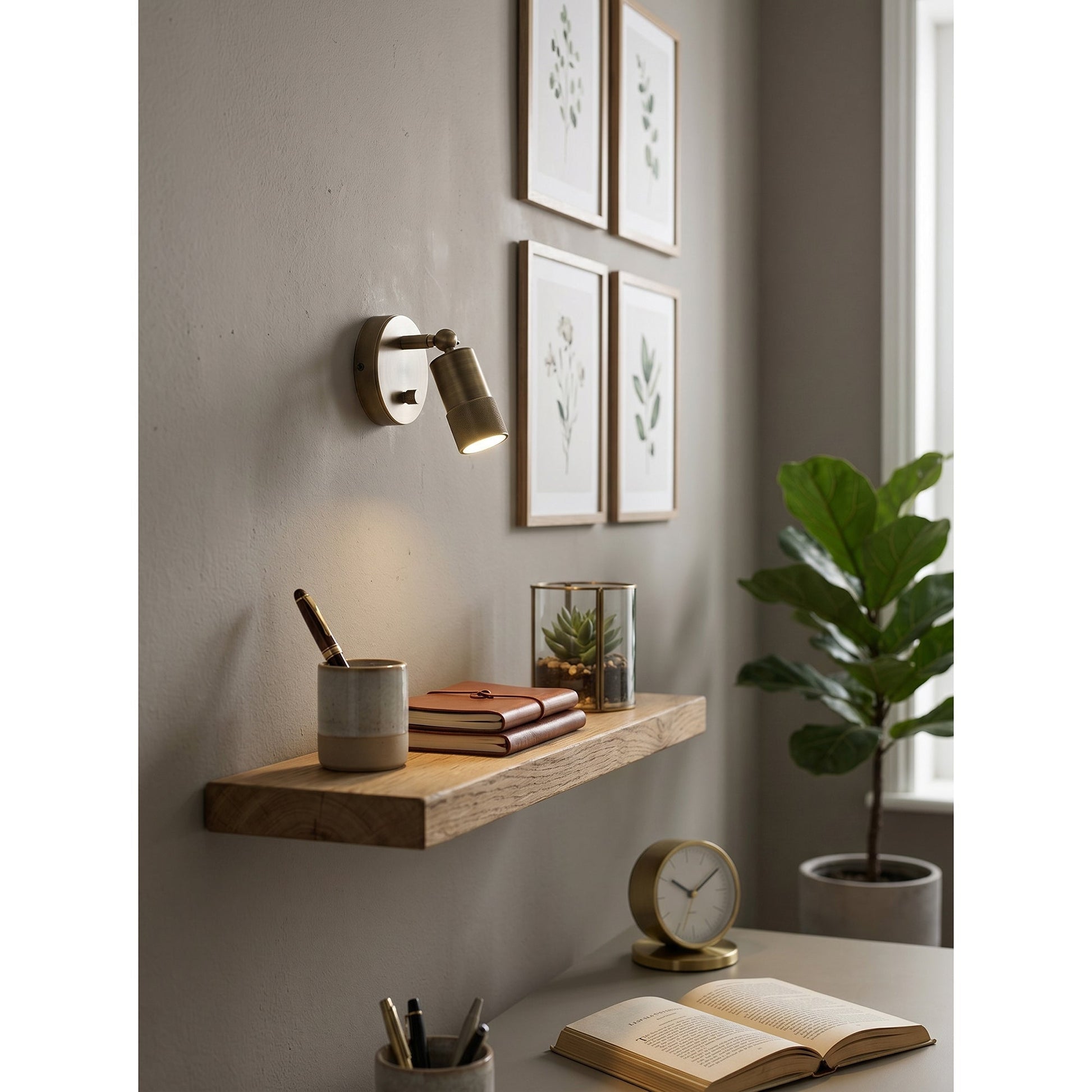 The Jura Wall Sconce hardwired to a wall.
