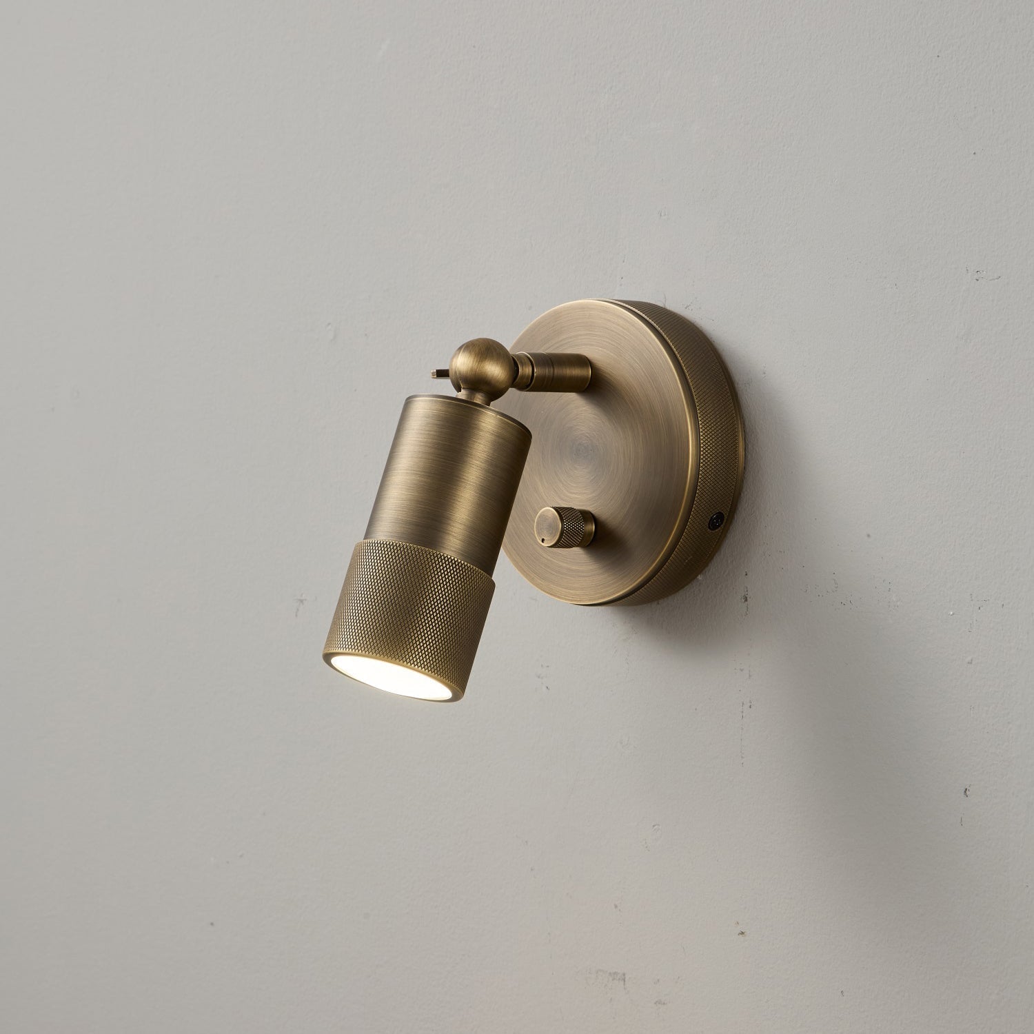 Jura Wall Sconce in a natural brass finish.