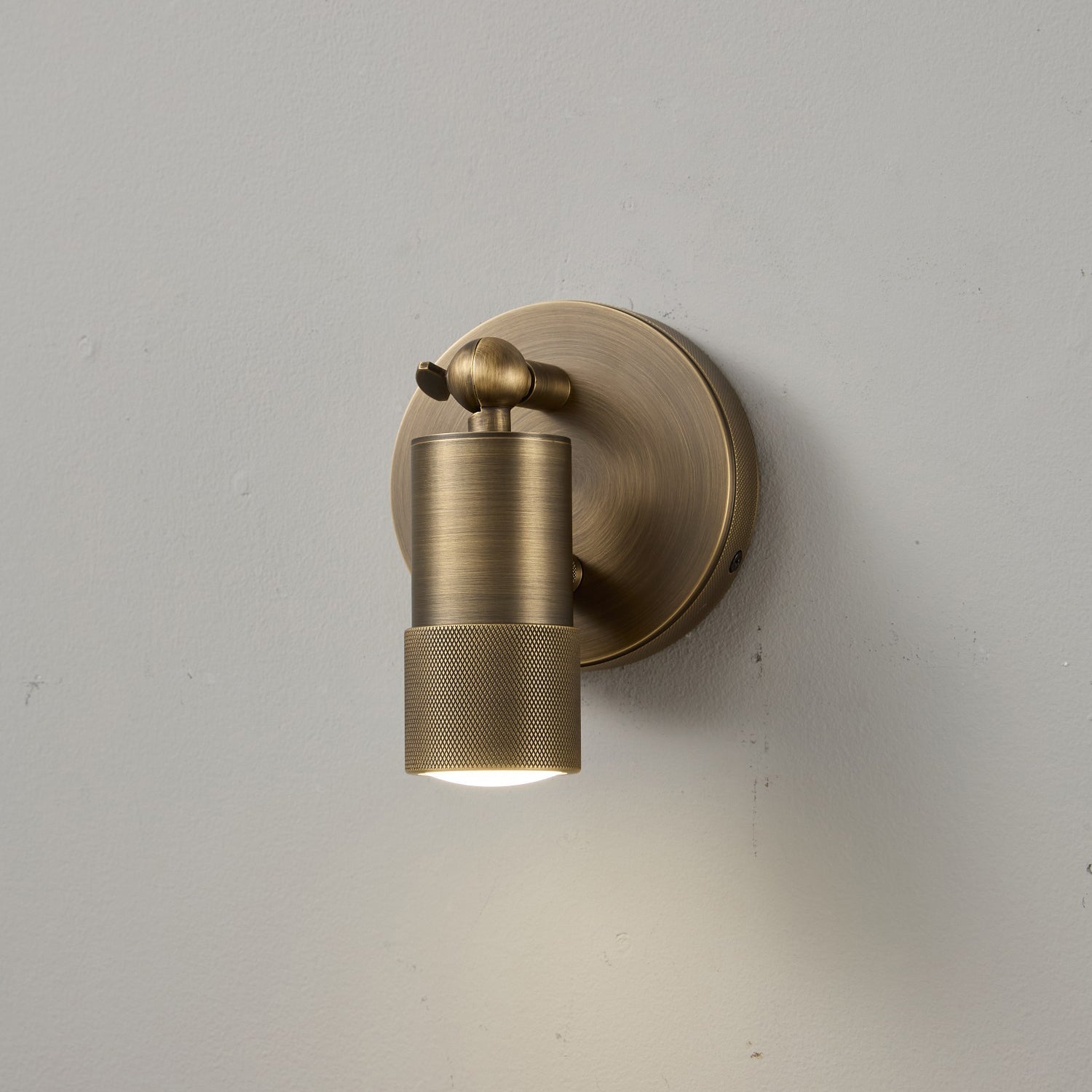 Angled view of the Jura Wall Sconce in antique bronze.