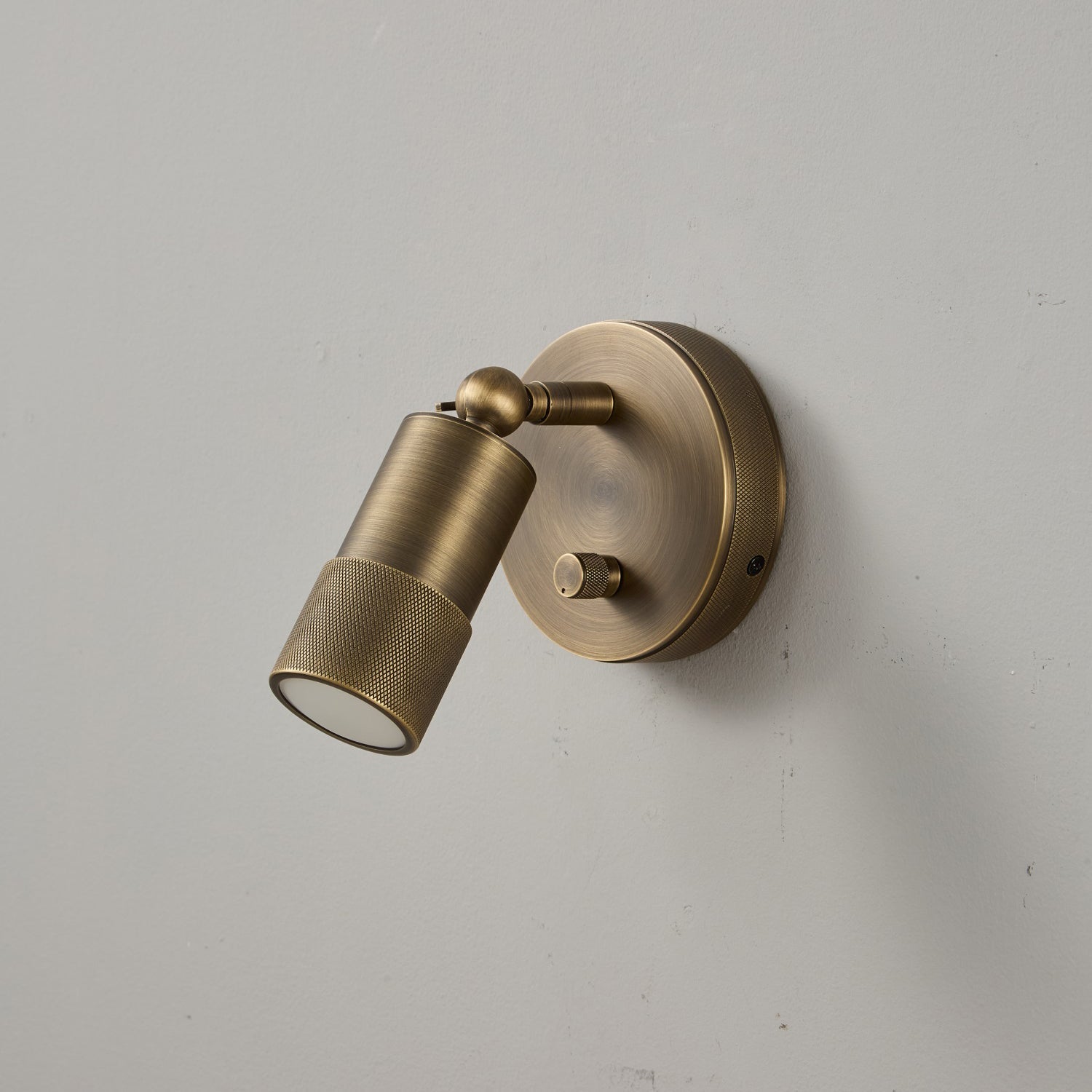Angled view of the Jura Wall Sconce in brass.
