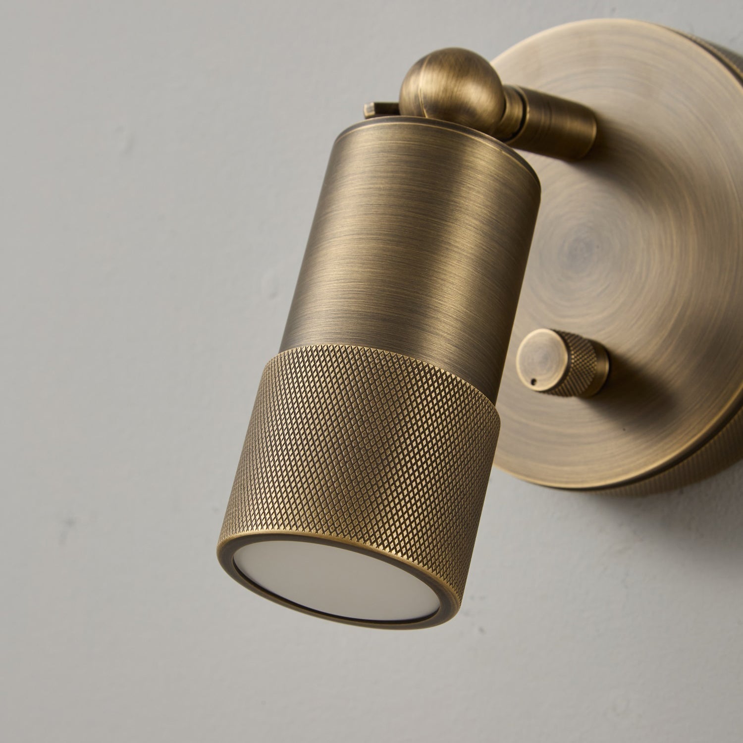 Jura Wall Sconce in a minimalist bedroom interior.