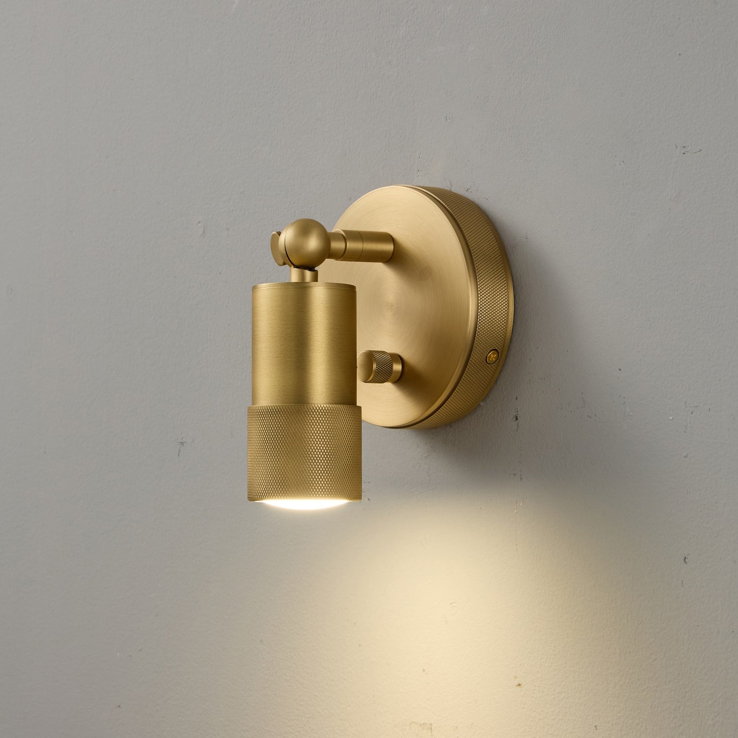Jura Wall Sconce in natural brass, detail shot.