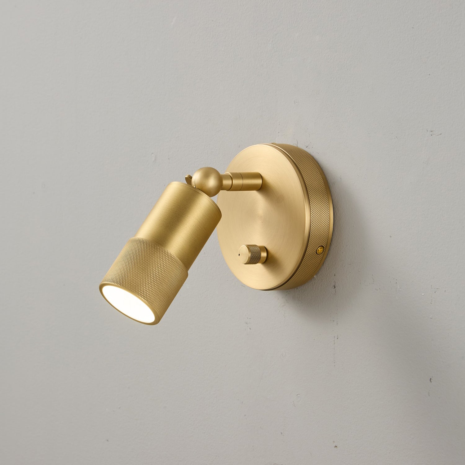 The sconce head tilted to direct light upwards.