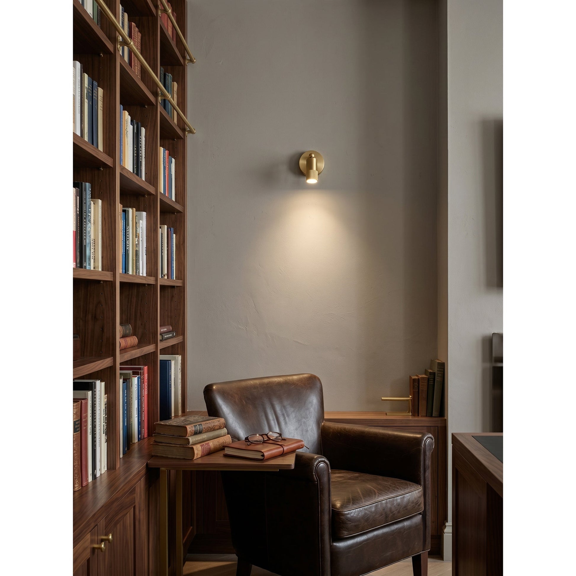 Jura Wall Sconce in a modern living room setting.