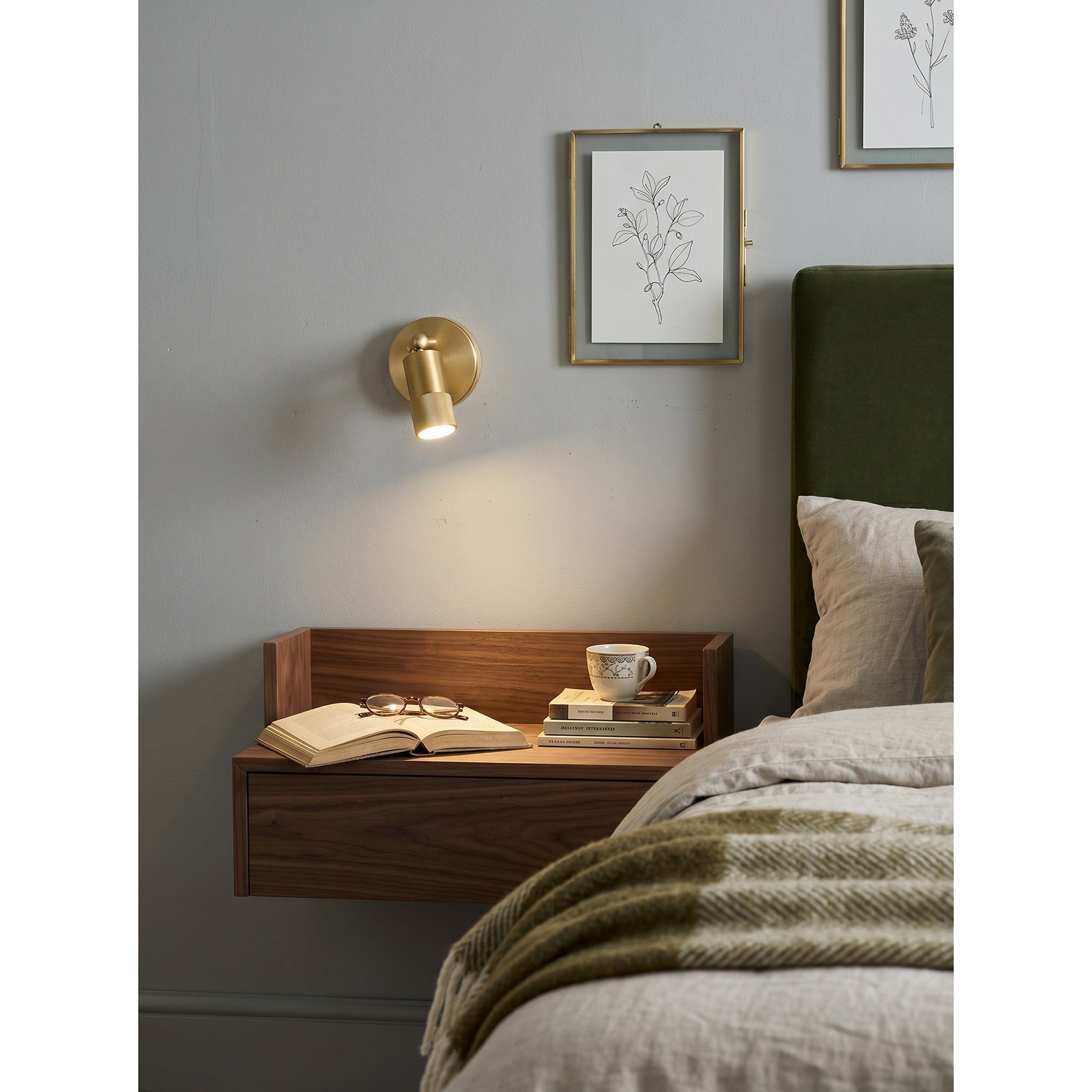 Side profile of the Jura Wall Sconce showcasing its form.
