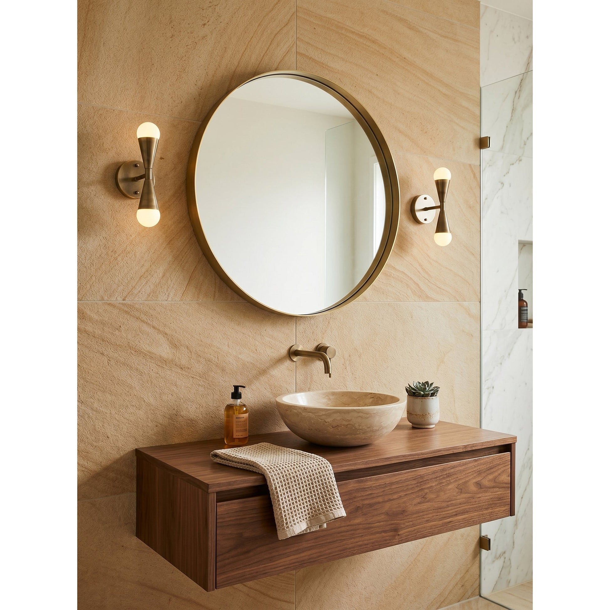 A pair of Karma Wall Sconces flanking a bathroom mirror.