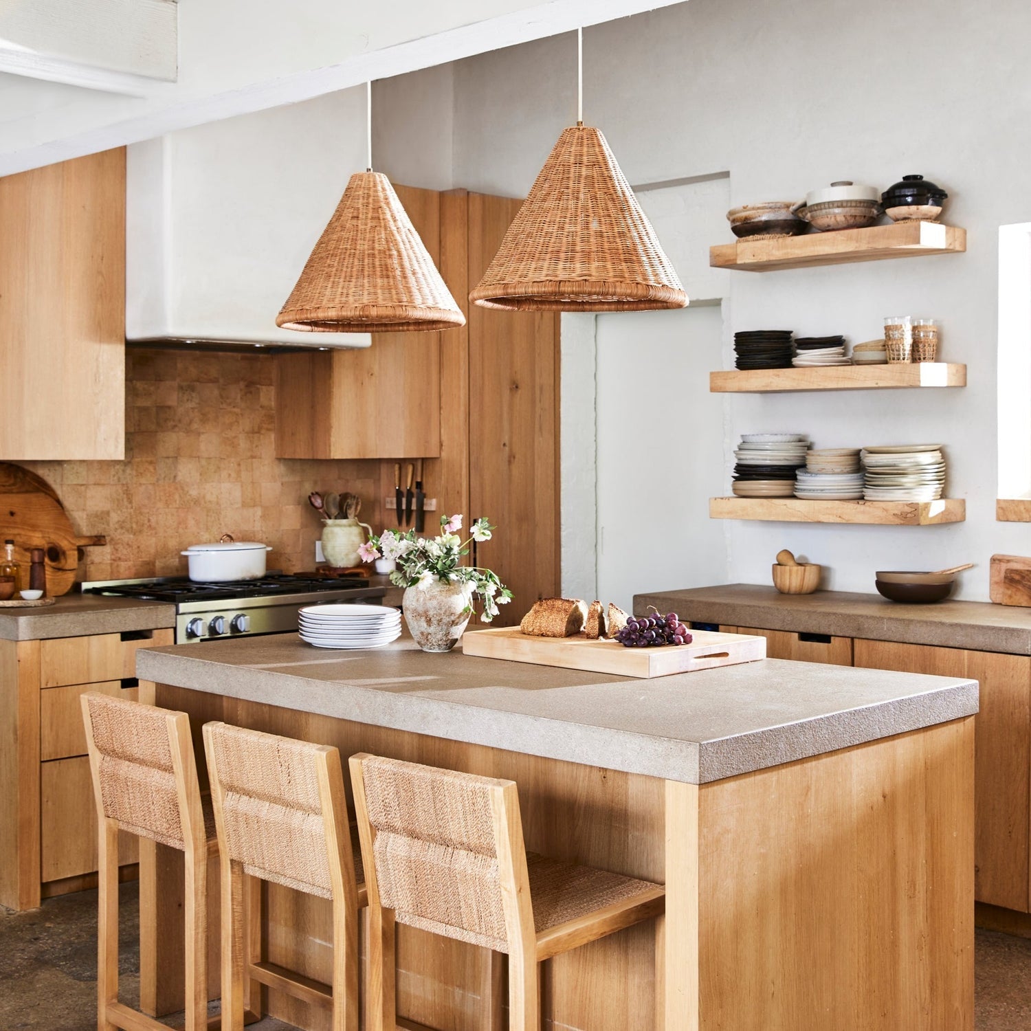 A pair of Kasbah pendant lamps over a kitchen island.