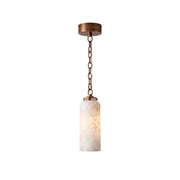 Katie Pendant Lamp in antique brass with a white glass shade.