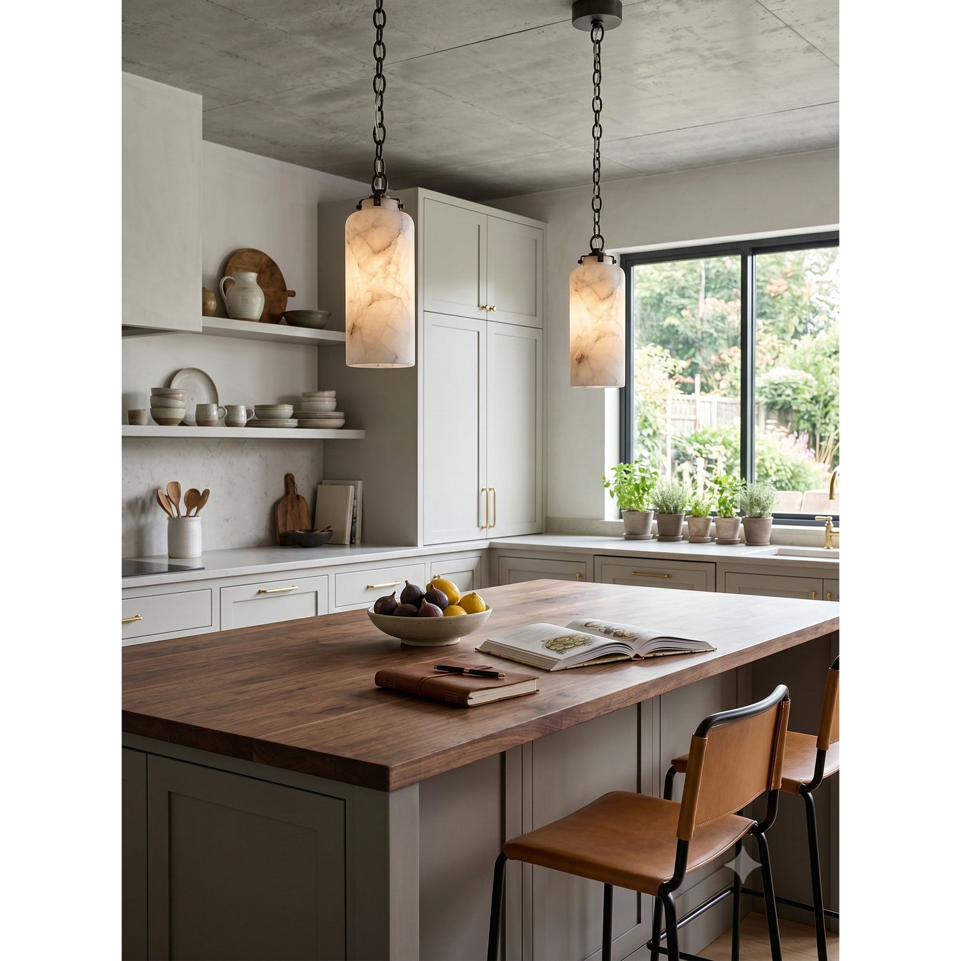 A pair of Katie Pendant Lamps hanging over a modern farmhouse kitchen island.