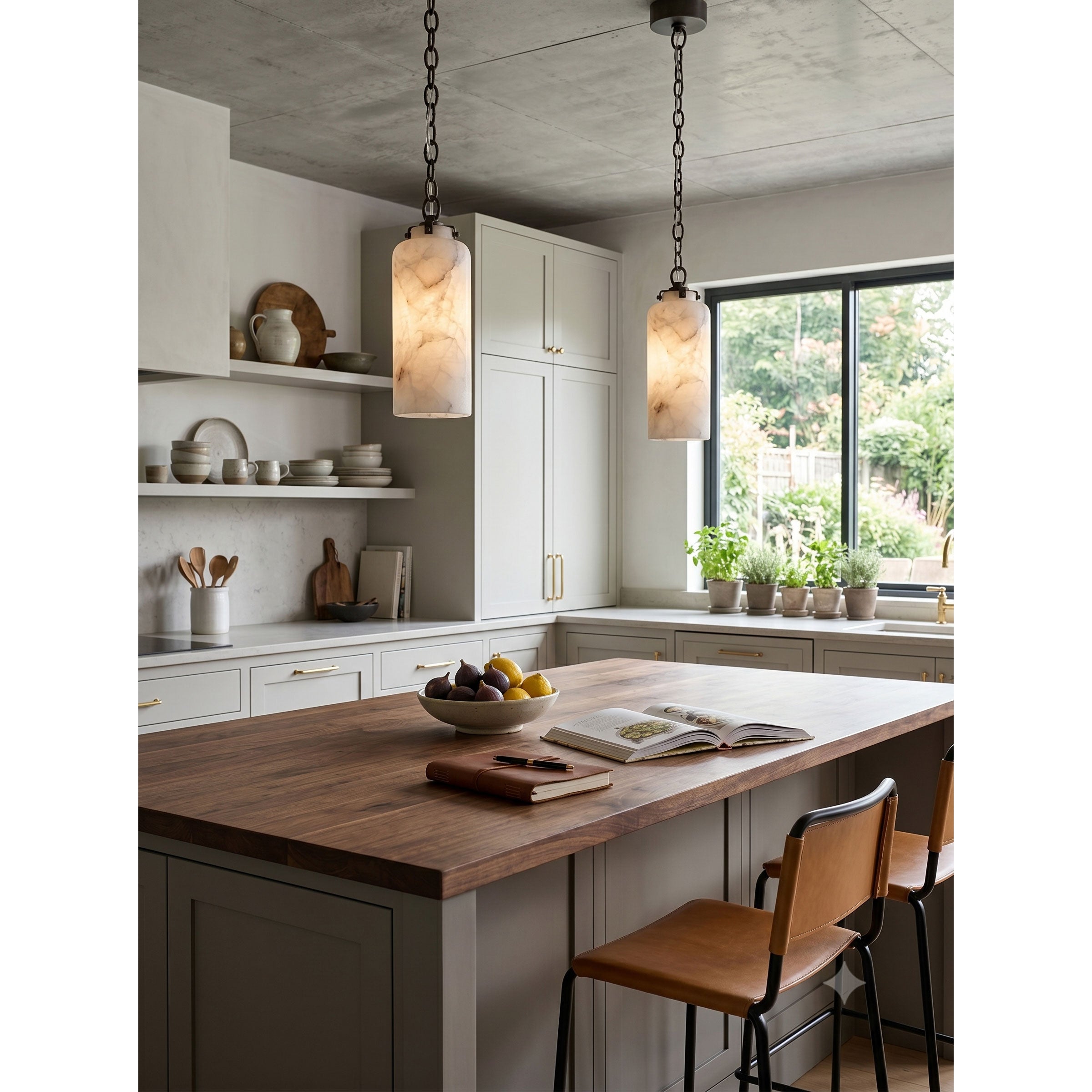 A pair of Katie Pendant Lamps hanging over a modern farmhouse kitchen island.