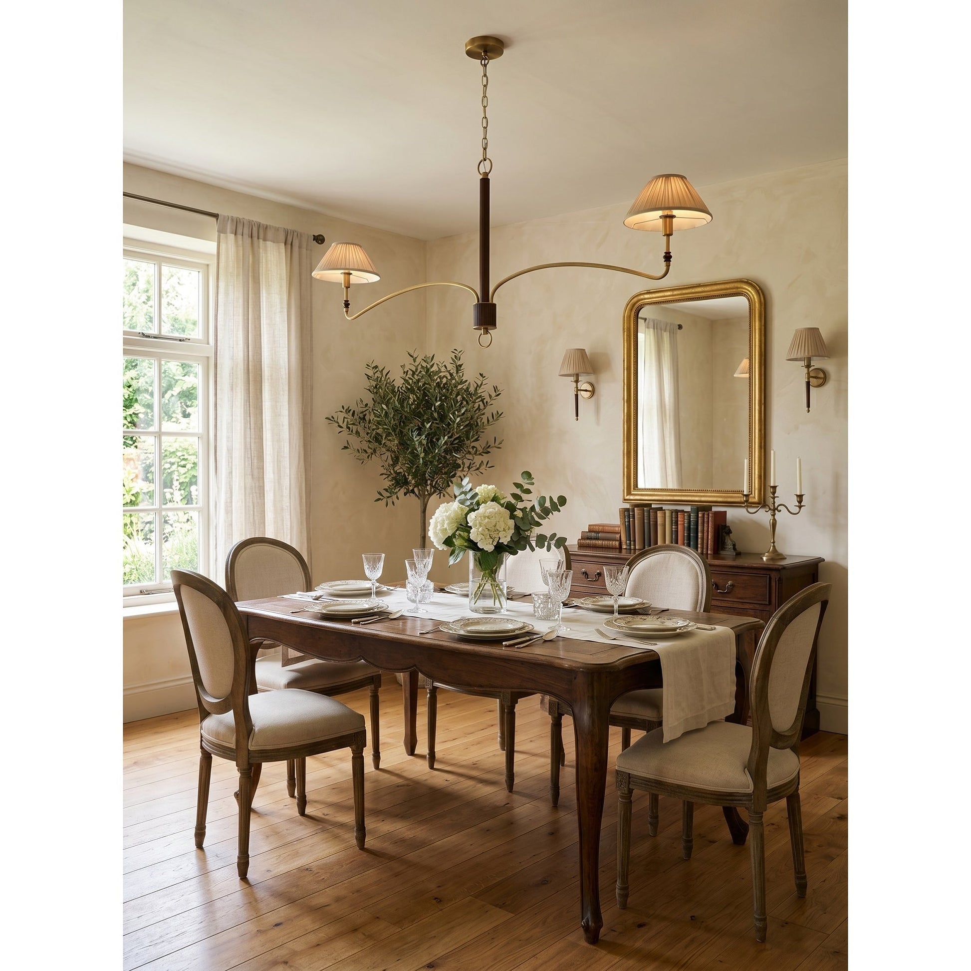 The Laurent Chandelier in a romantic primary bedroom setting.