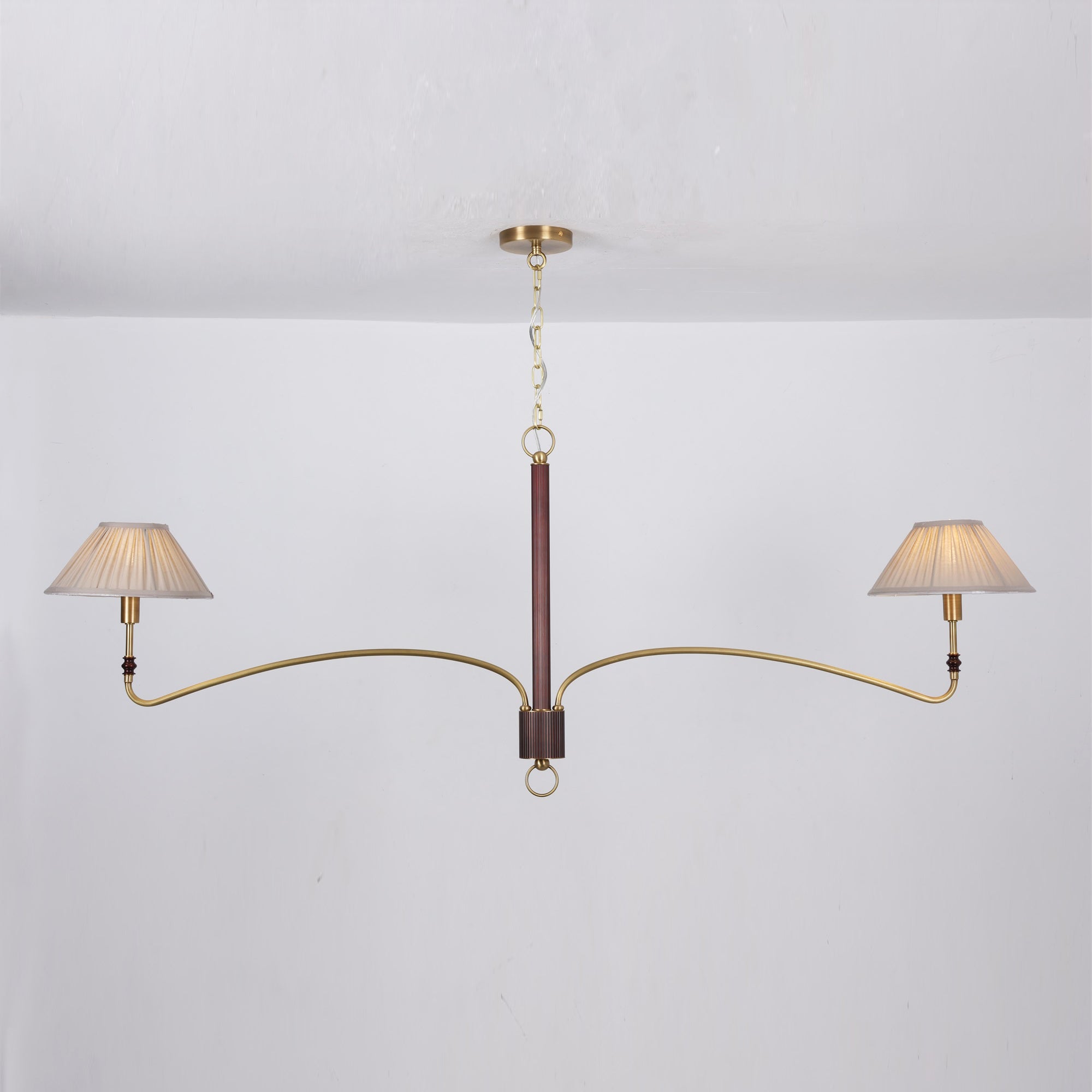 The chandelier shown with lights on, creating a warm glow.