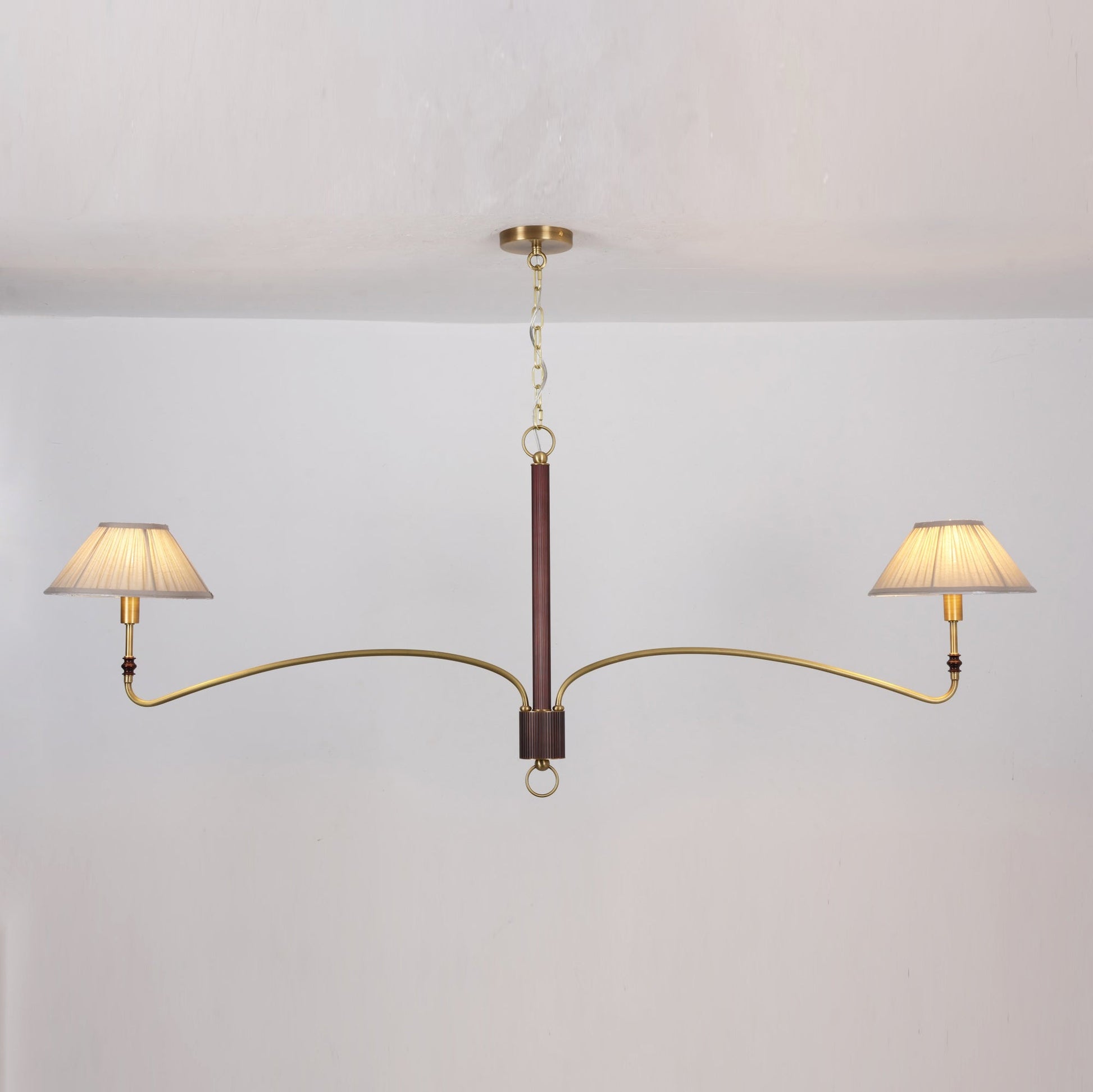 The chandelier shown with lights off, displaying its form and materials.