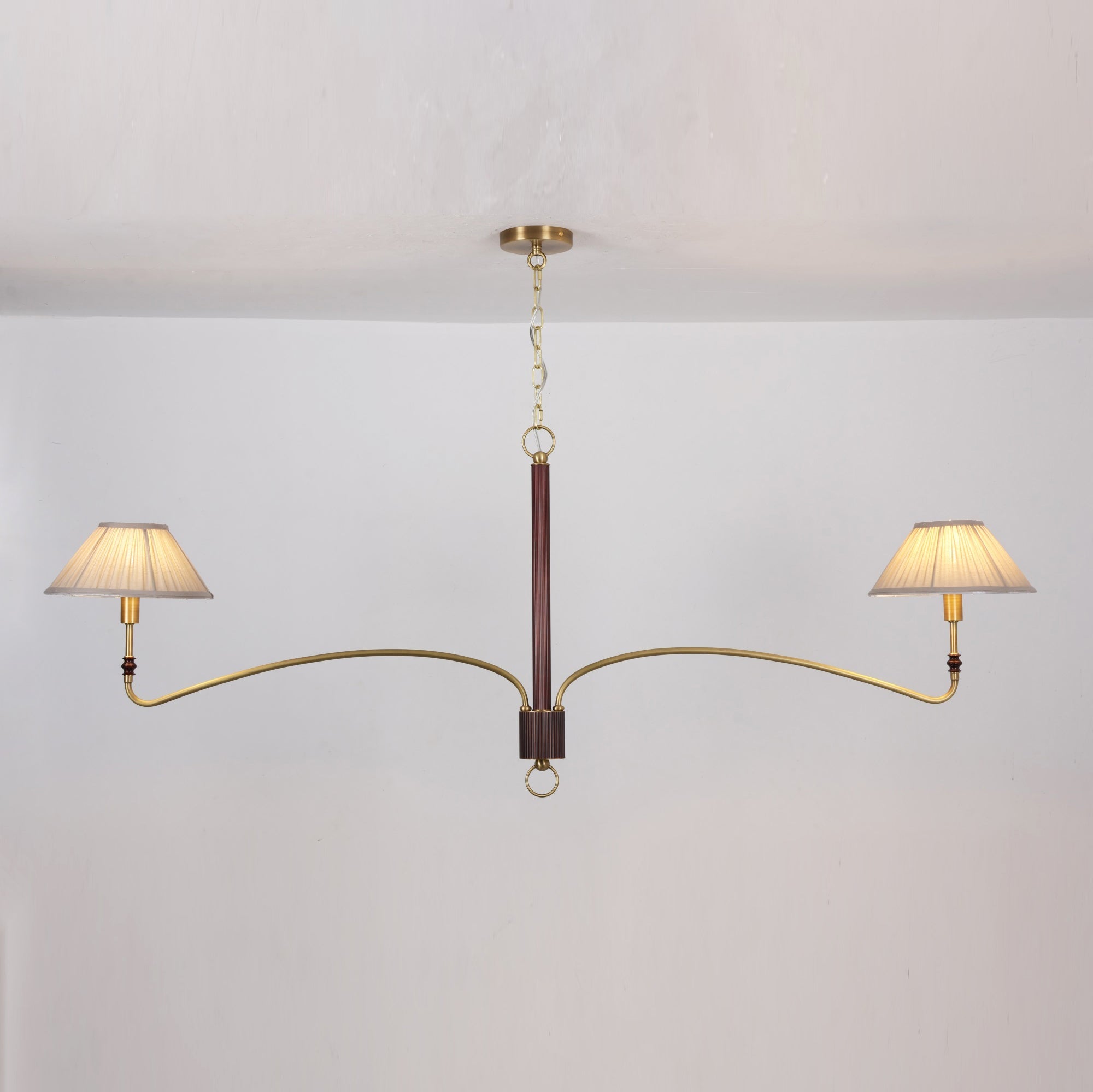 The chandelier shown with lights off, displaying its form and materials.