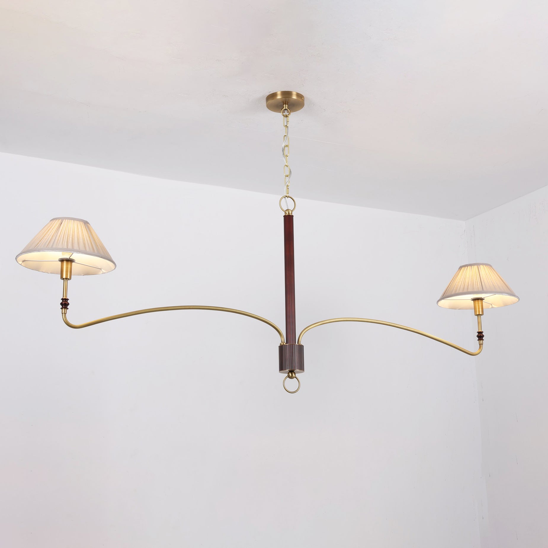 The Laurent Chandelier as a focal point in a minimalist traditional room.