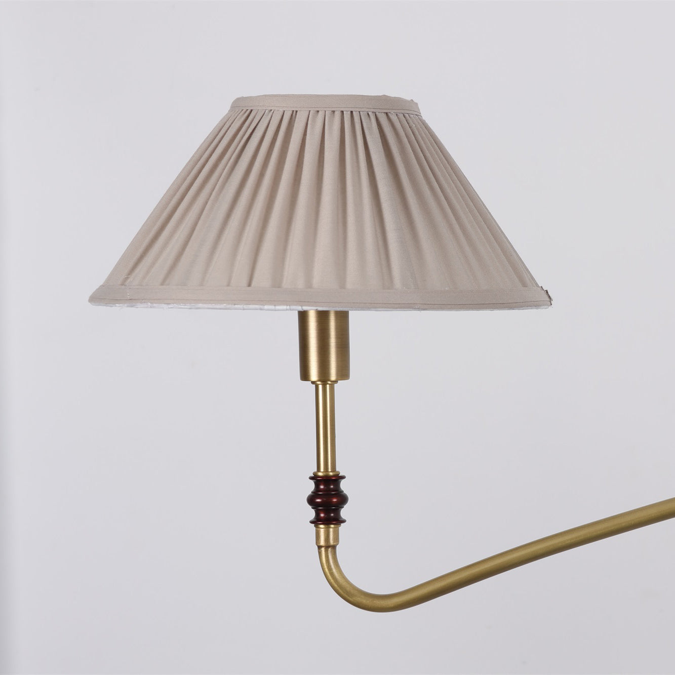The Laurent Chandelier hanging above a round dining table.