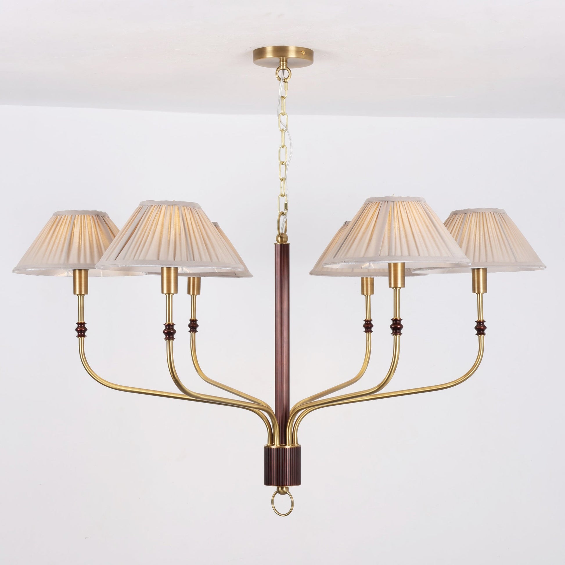 The linear Laurent Chandelier providing light over a kitchen island.