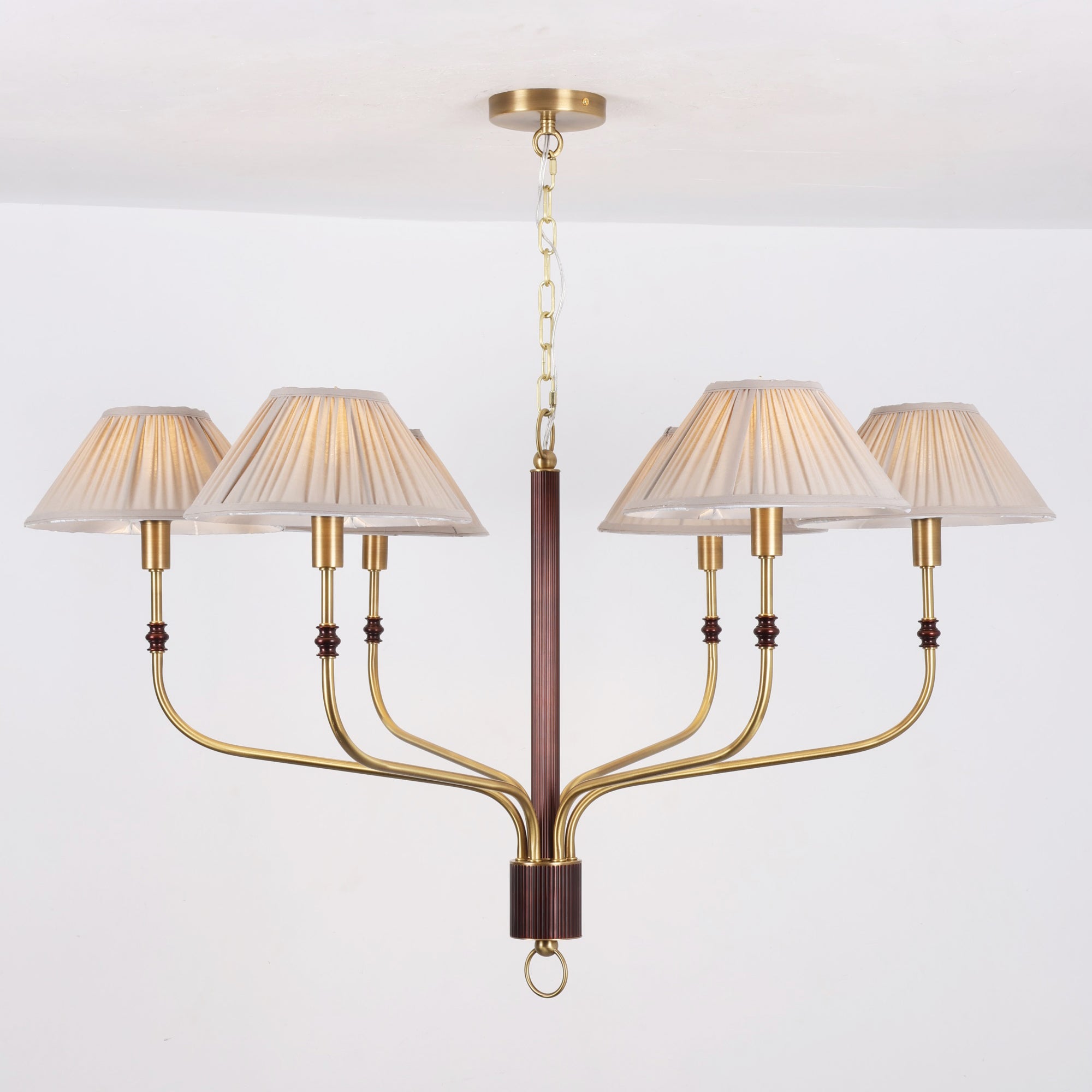 The linear Laurent Chandelier providing light over a kitchen island.