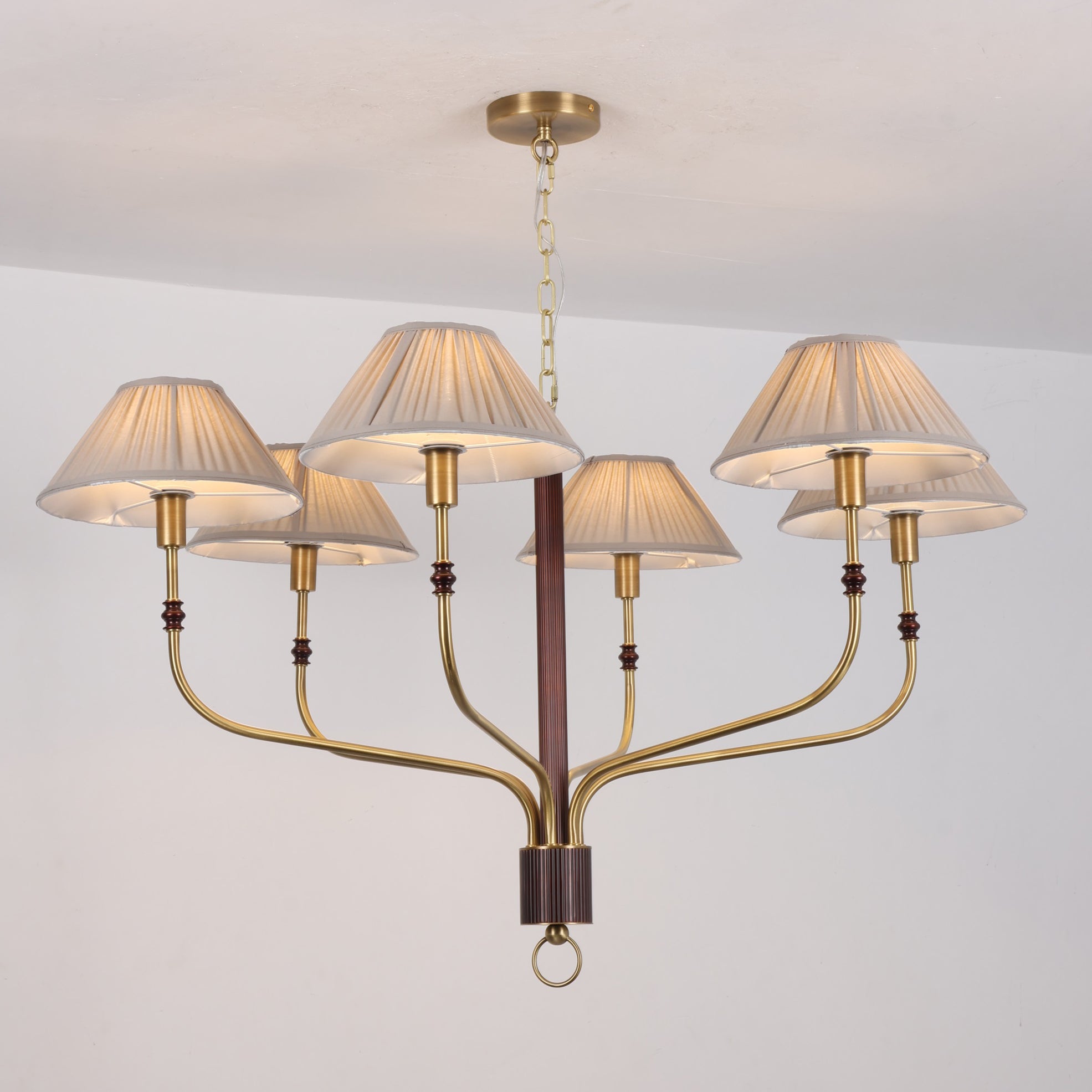 The Laurent Chandelier in a bright, airy living room.
