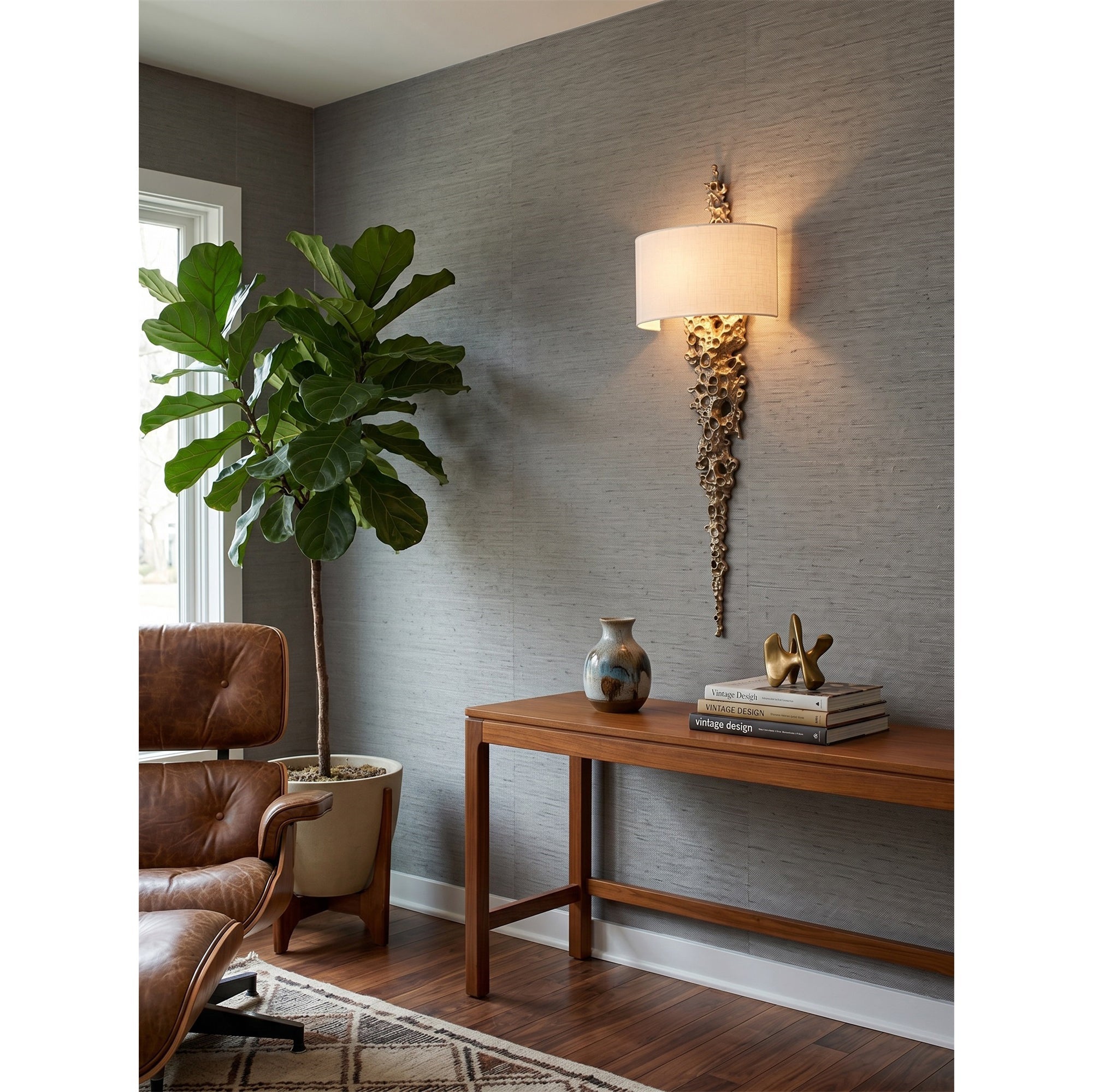 The silver Lava sconce with a white shade in a bright hallway.