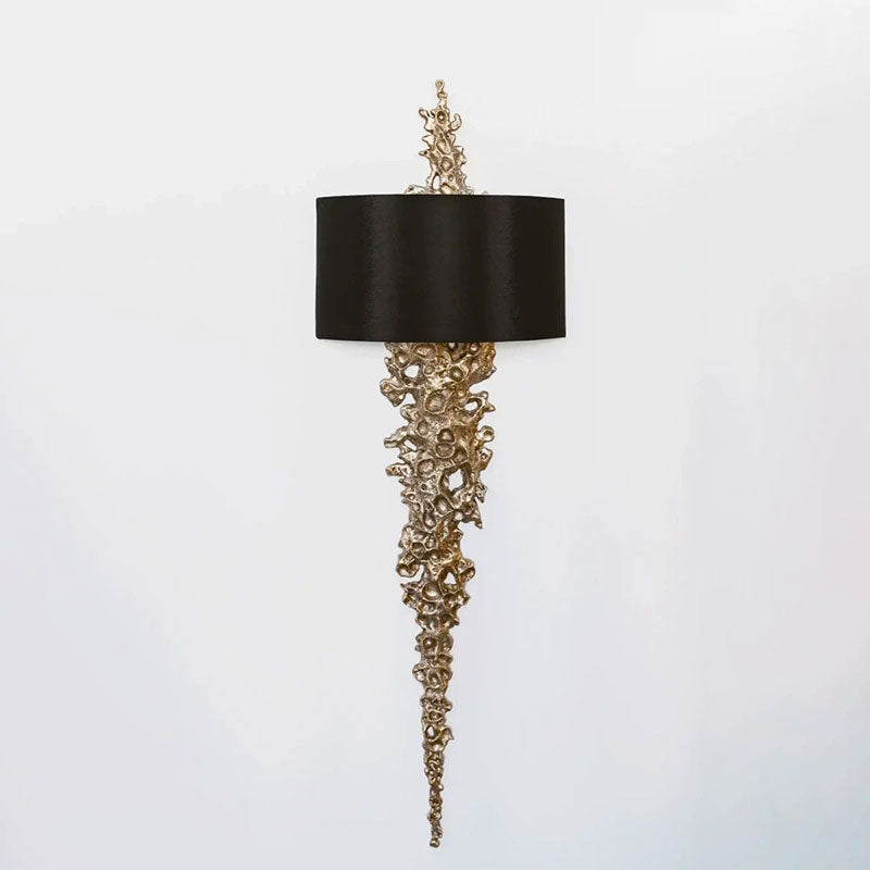 The silver finish Lava sconce against a minimalist white wall.