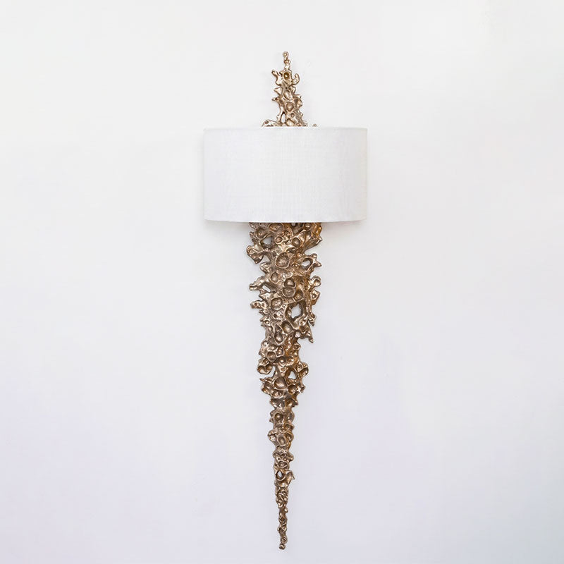 Lifestyle image of the Lava sconce in a luxurious dining room.