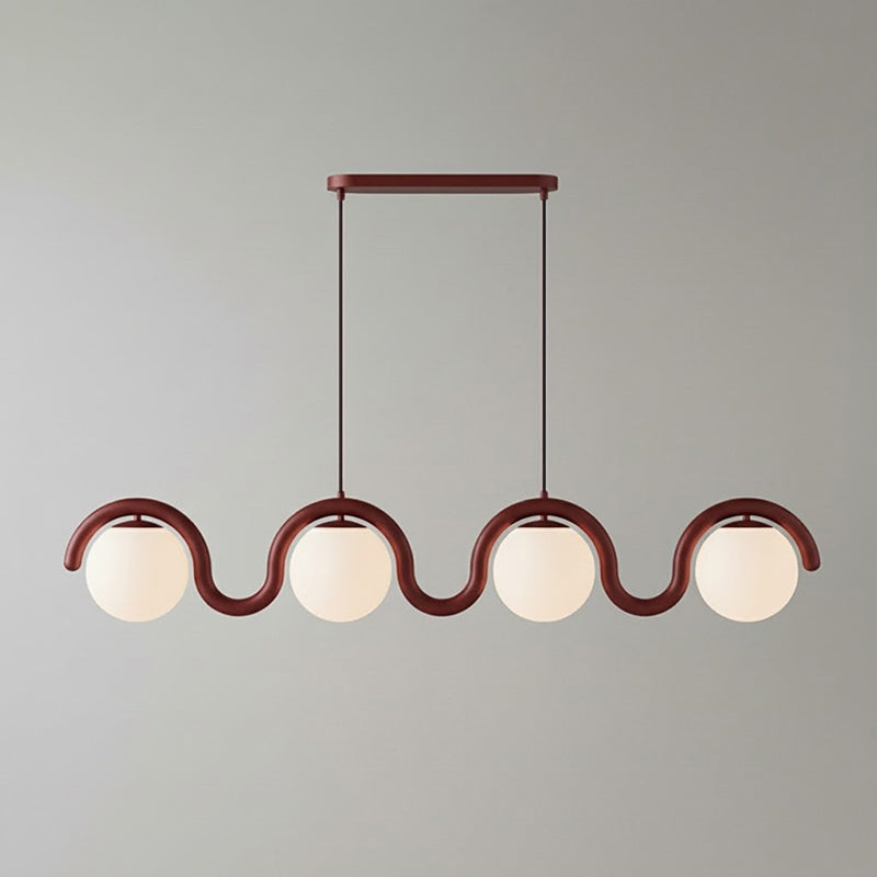 Lenox pendant lamp installed over a long dining table.