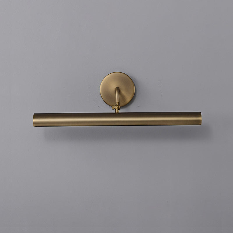 Loxen Wall Sconce installed over a floating shelf display.