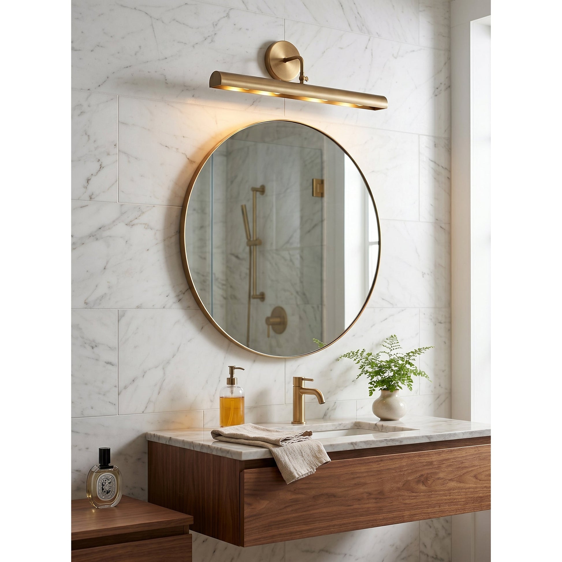 The Loxen Wall Sconce used as a vanity light in a modern bathroom.