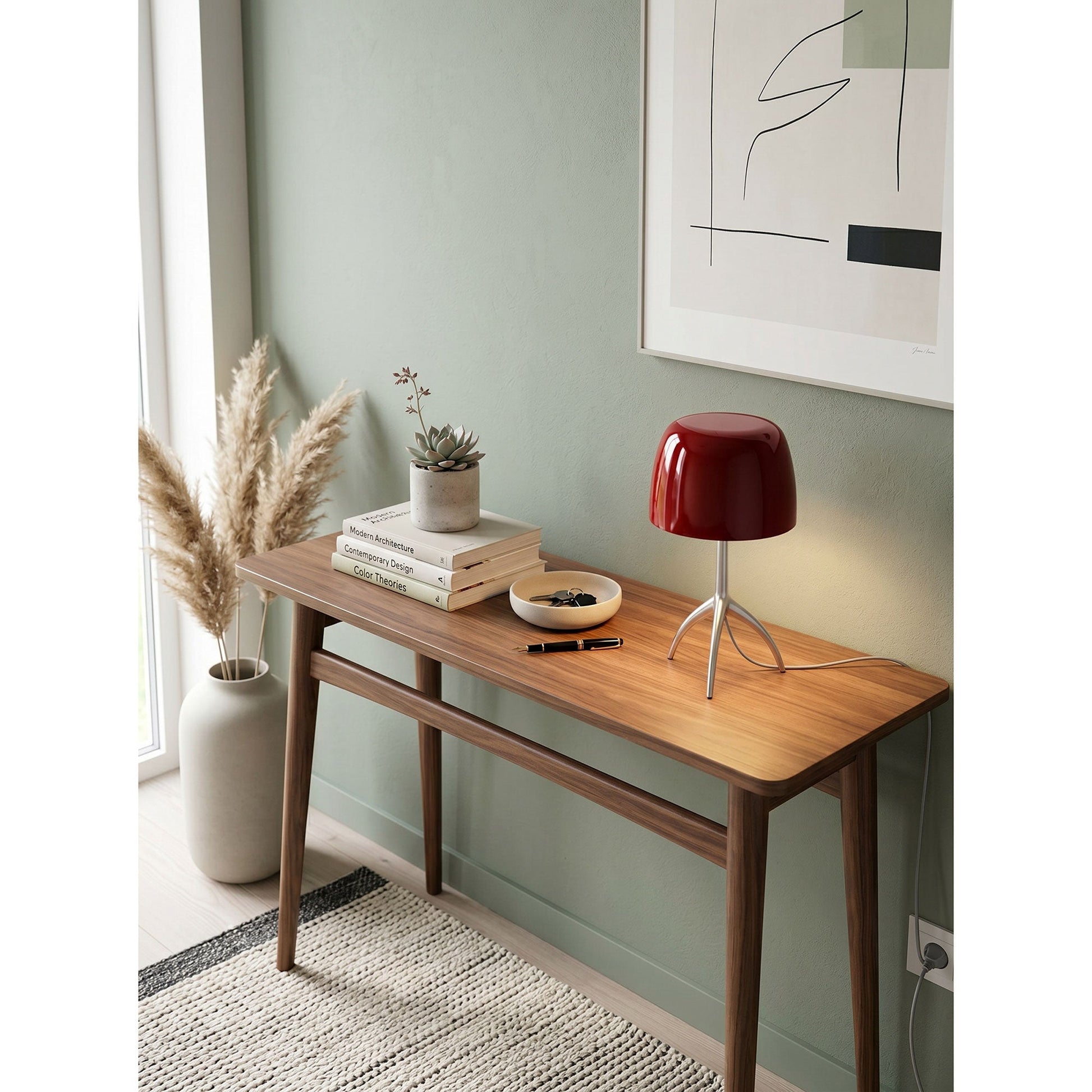 The Lumiere Table Lamp shown from a low angle to emphasize its tripod legs.