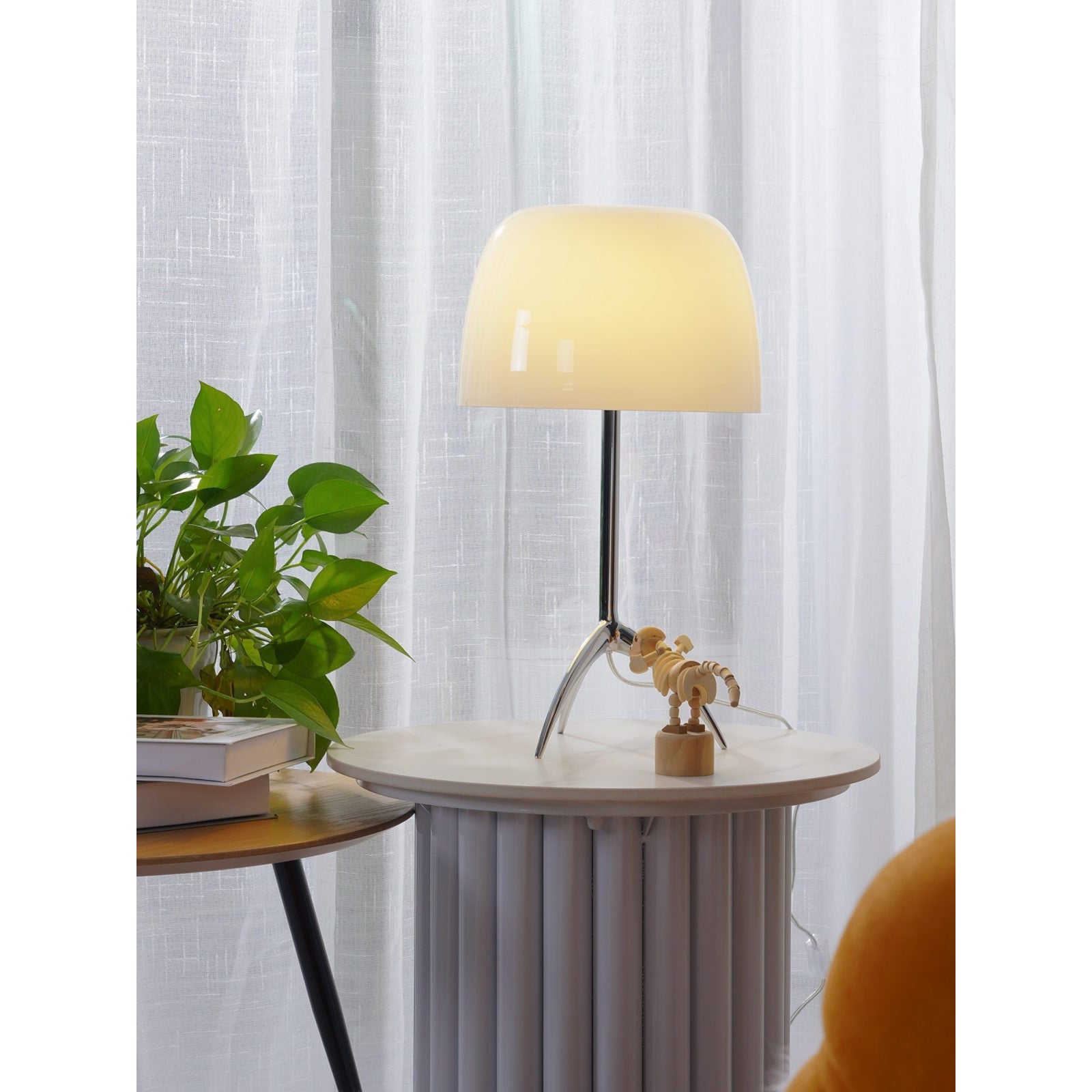 The Lumiere Table Lamp against a dark background.