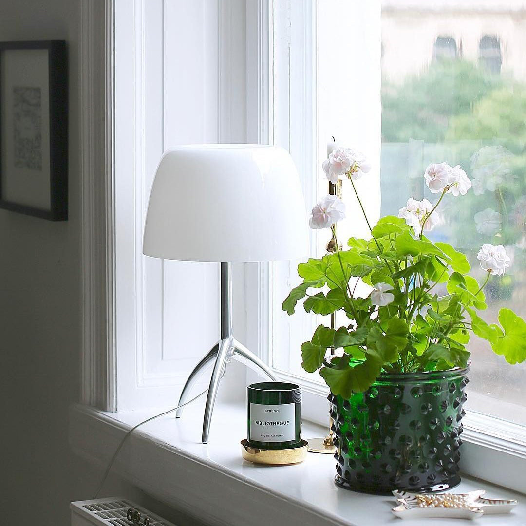 Lumiere Table Lamp with white glass shade on a chrome tripod base.