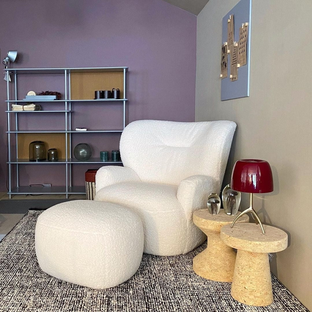 The Lumiere Table Lamp displayed on a living room credenza.