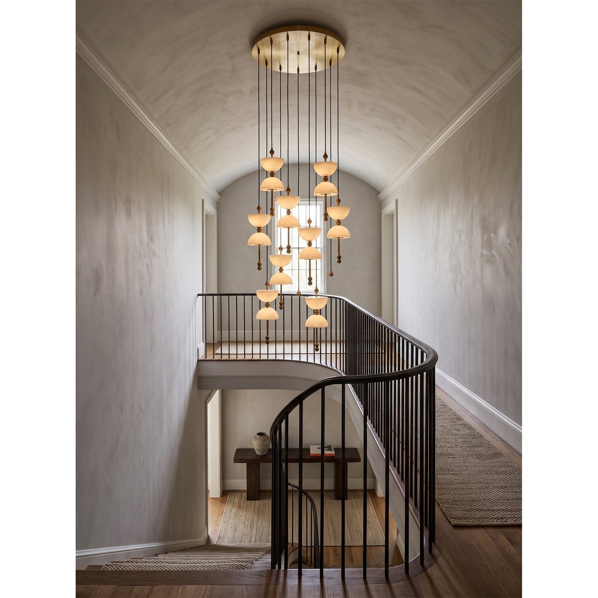 The 5-head Lyra Chandelier hanging over a contemporary dining table.