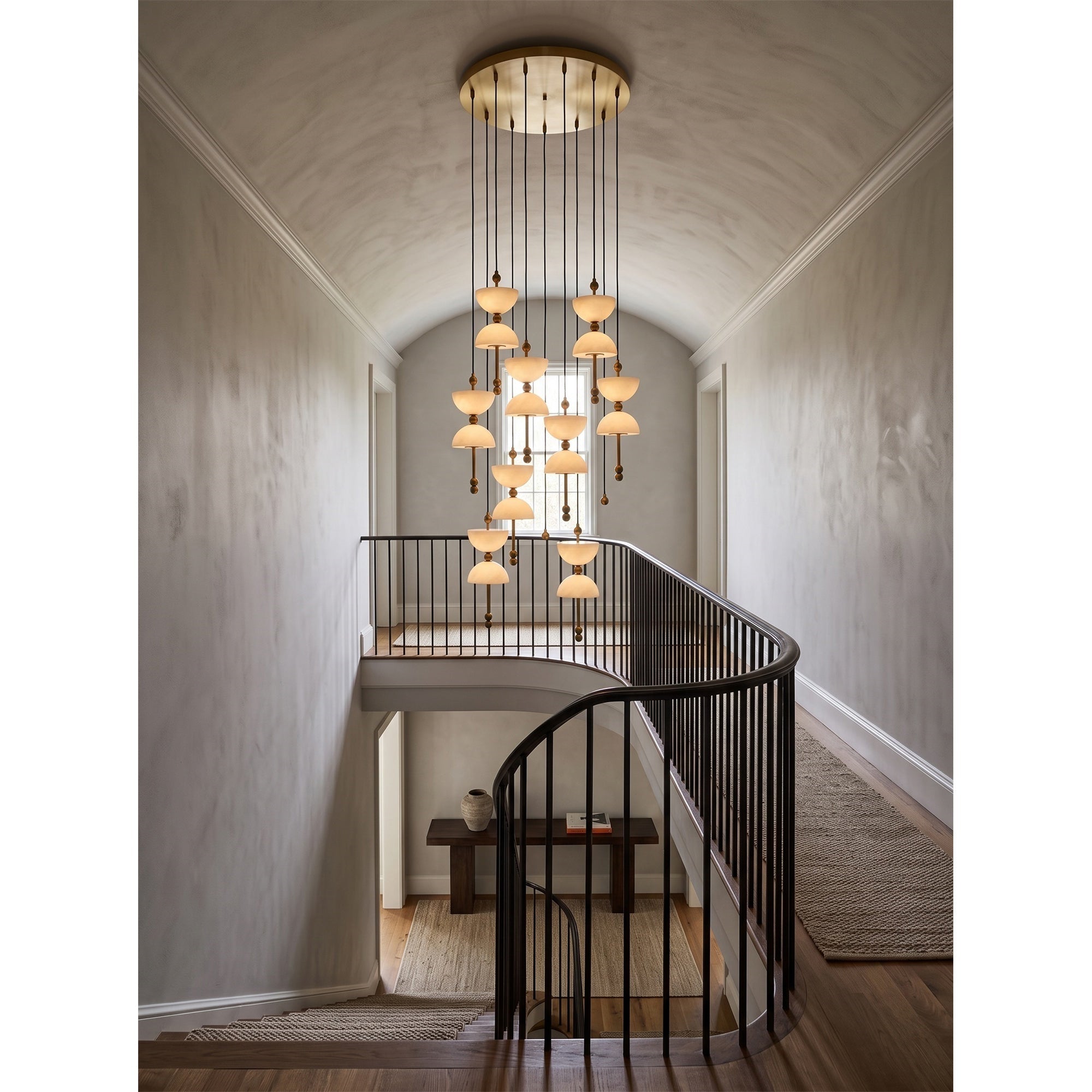 The 5-head Lyra Chandelier hanging over a contemporary dining table.
