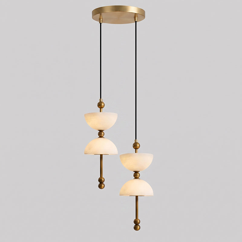 The cascading Lyra Chandelier installed in a double-height foyer.