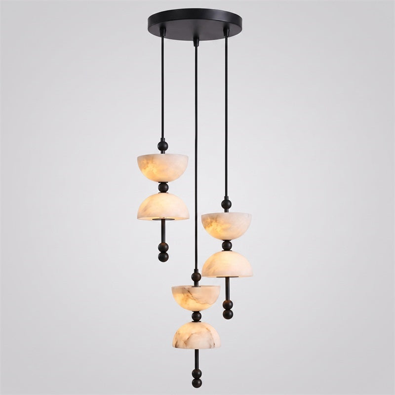 The 12-head Lyra Chandelier creating a dramatic statement in a luxury stairwell.