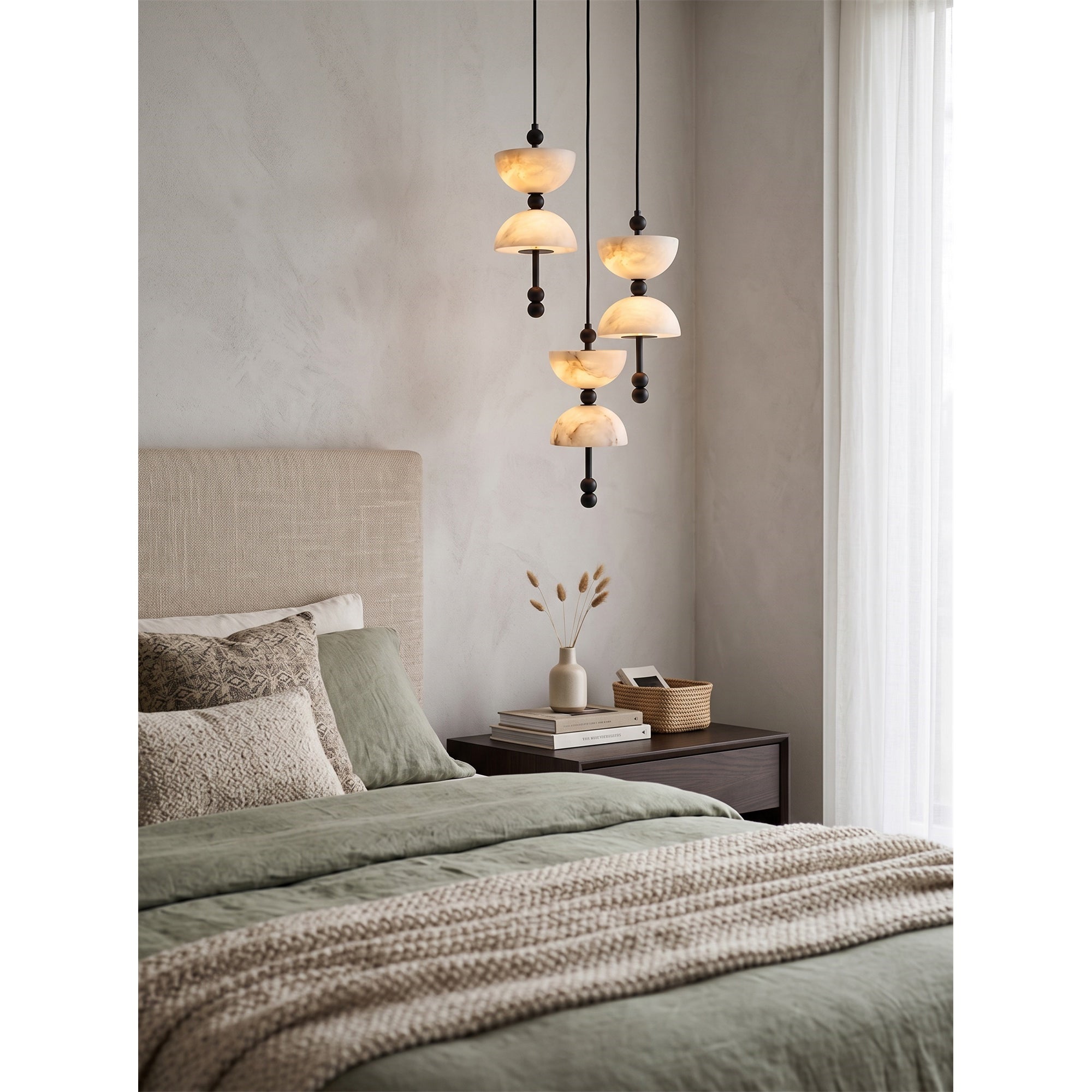 Lyra Chandelier shown against a dark wall to highlight its form.