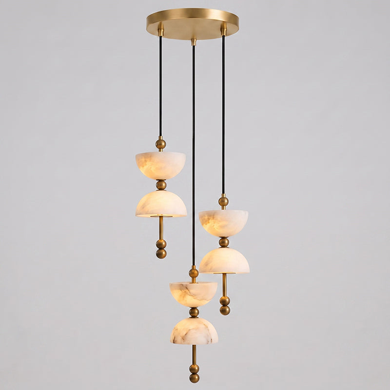 The 5-head Lyra Chandelier hanging over a contemporary dining table.