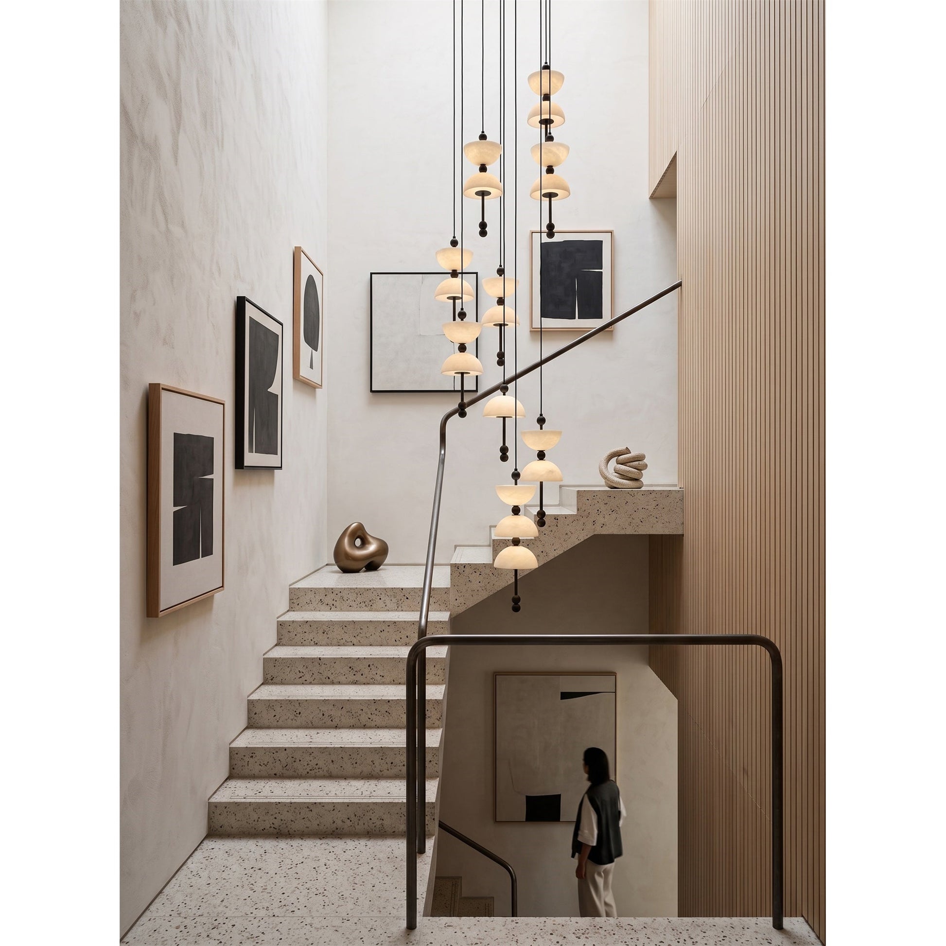 Lyra Alabaster Chandelier in a vaulted ceiling dining room.