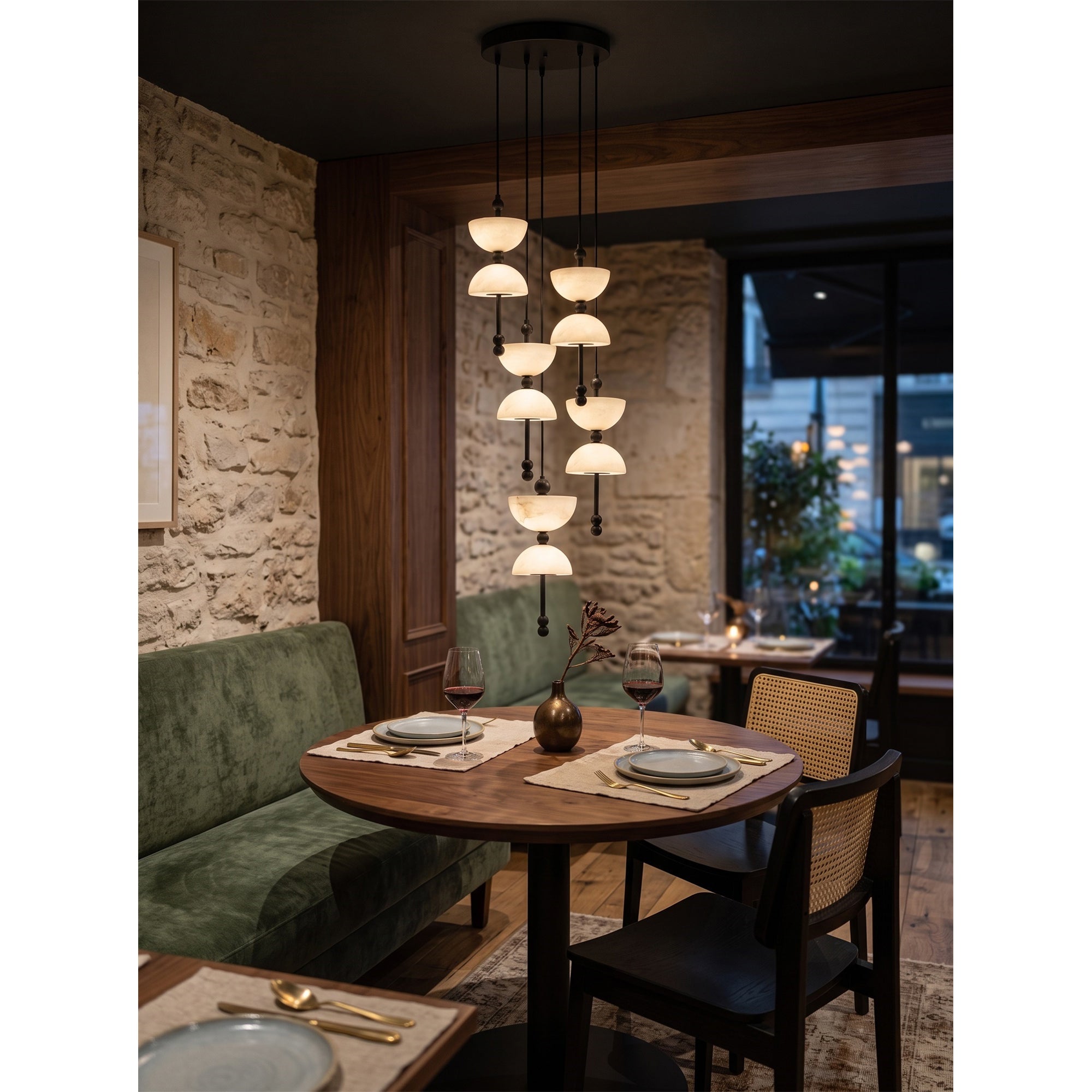 Lyra Alabaster Chandelier with brass accents in a modern entryway.