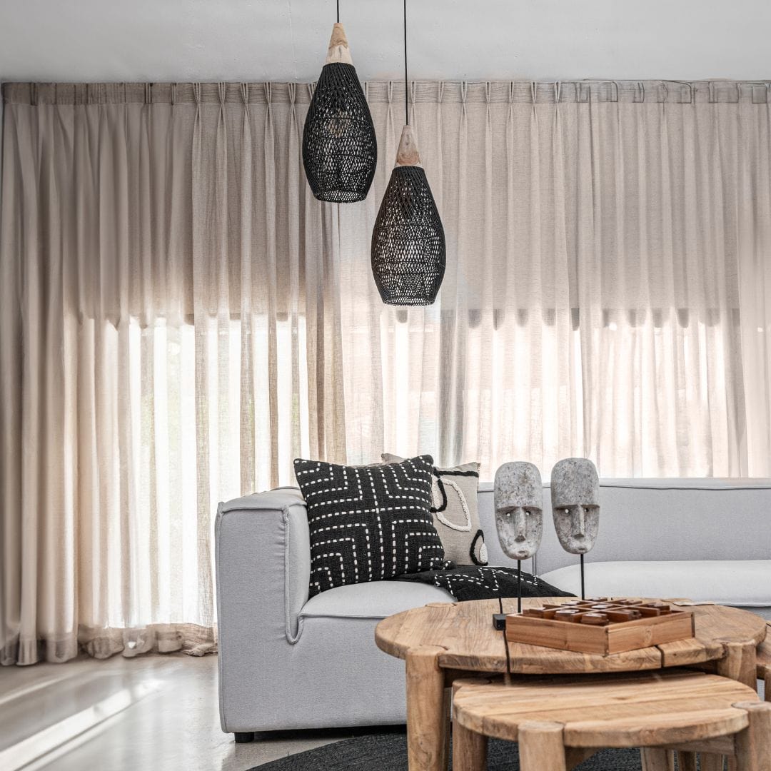 Teardrop silhouette of the black rattan Mallorca Pendant Lamp.