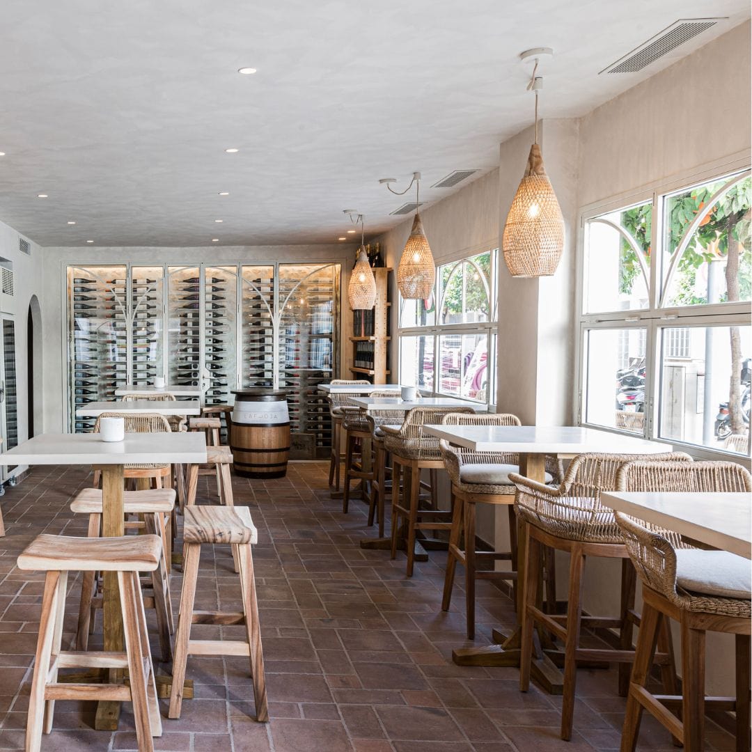 Mallorca Pendant Lamp hanging over a modern dining table.