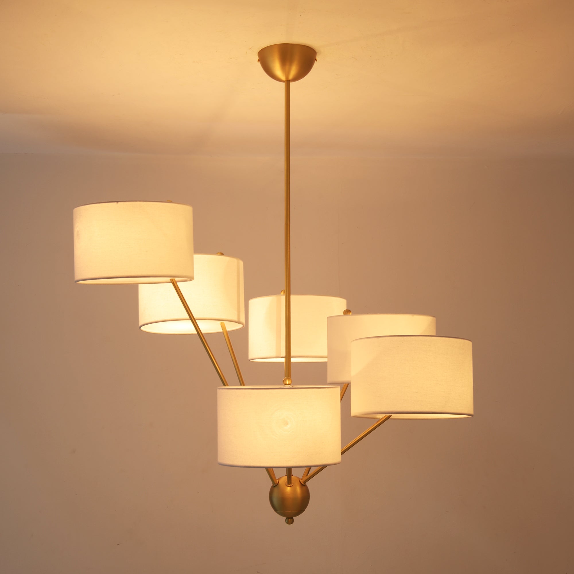 The Mantis Chandelier as a focal point in an open-concept living space.