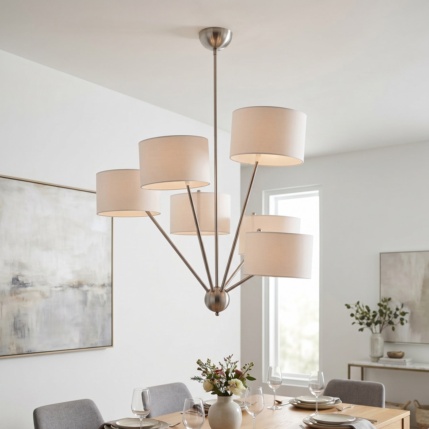 Mantis Fabric Chandelier hanging in a modern living room with high ceilings.