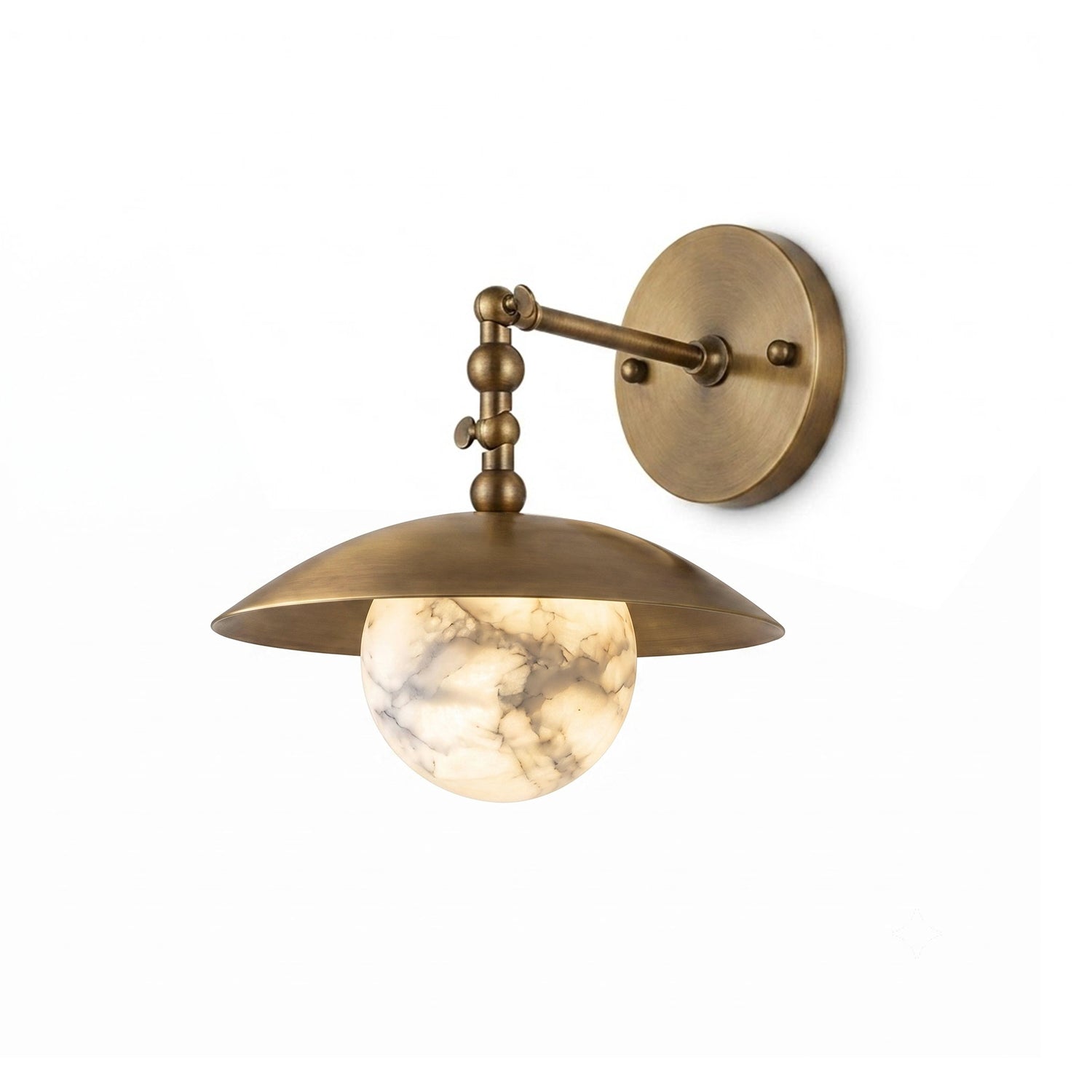 The sconce casting a warm glow on a textured wall.